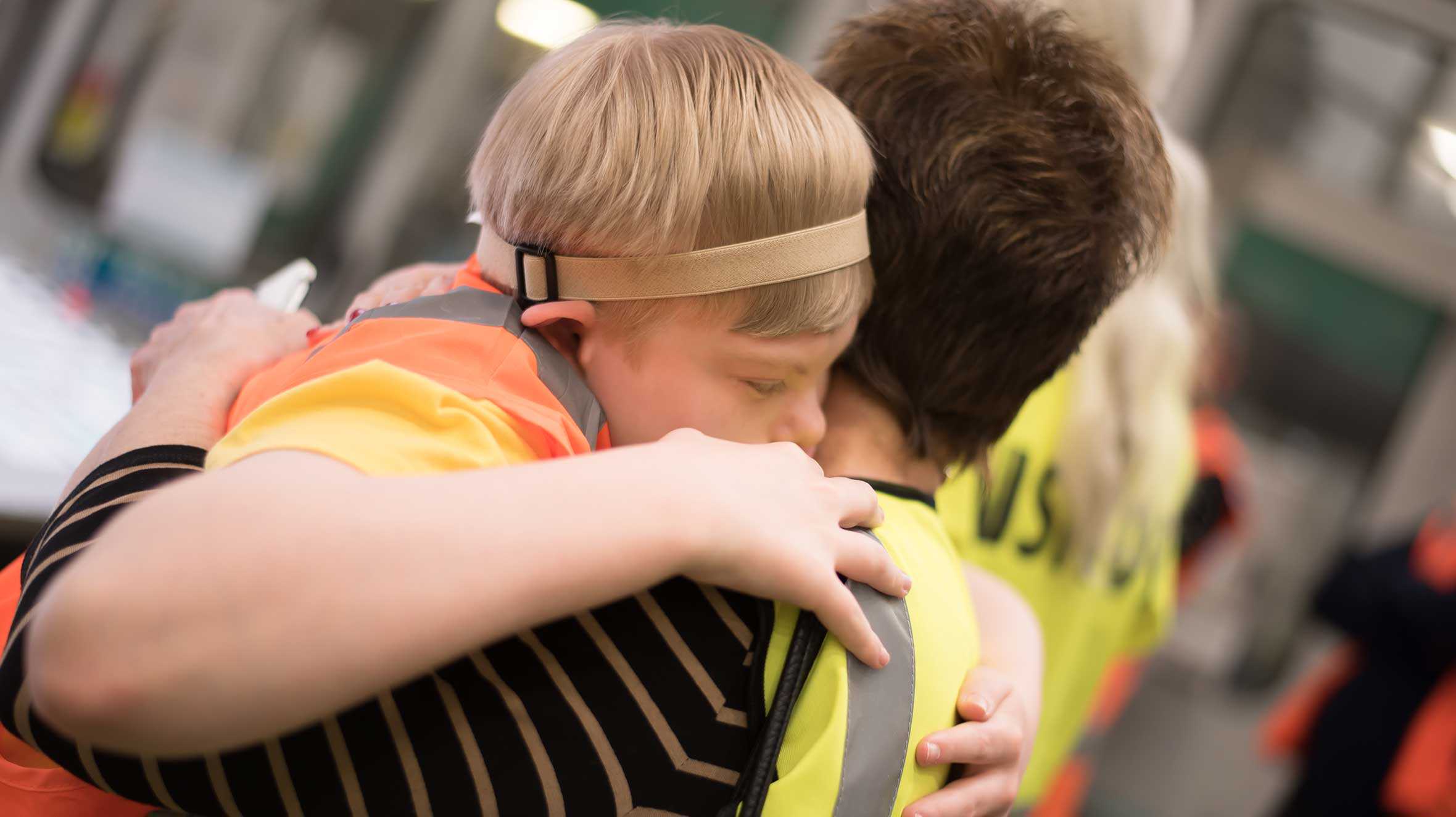 Georeg hugging his mum