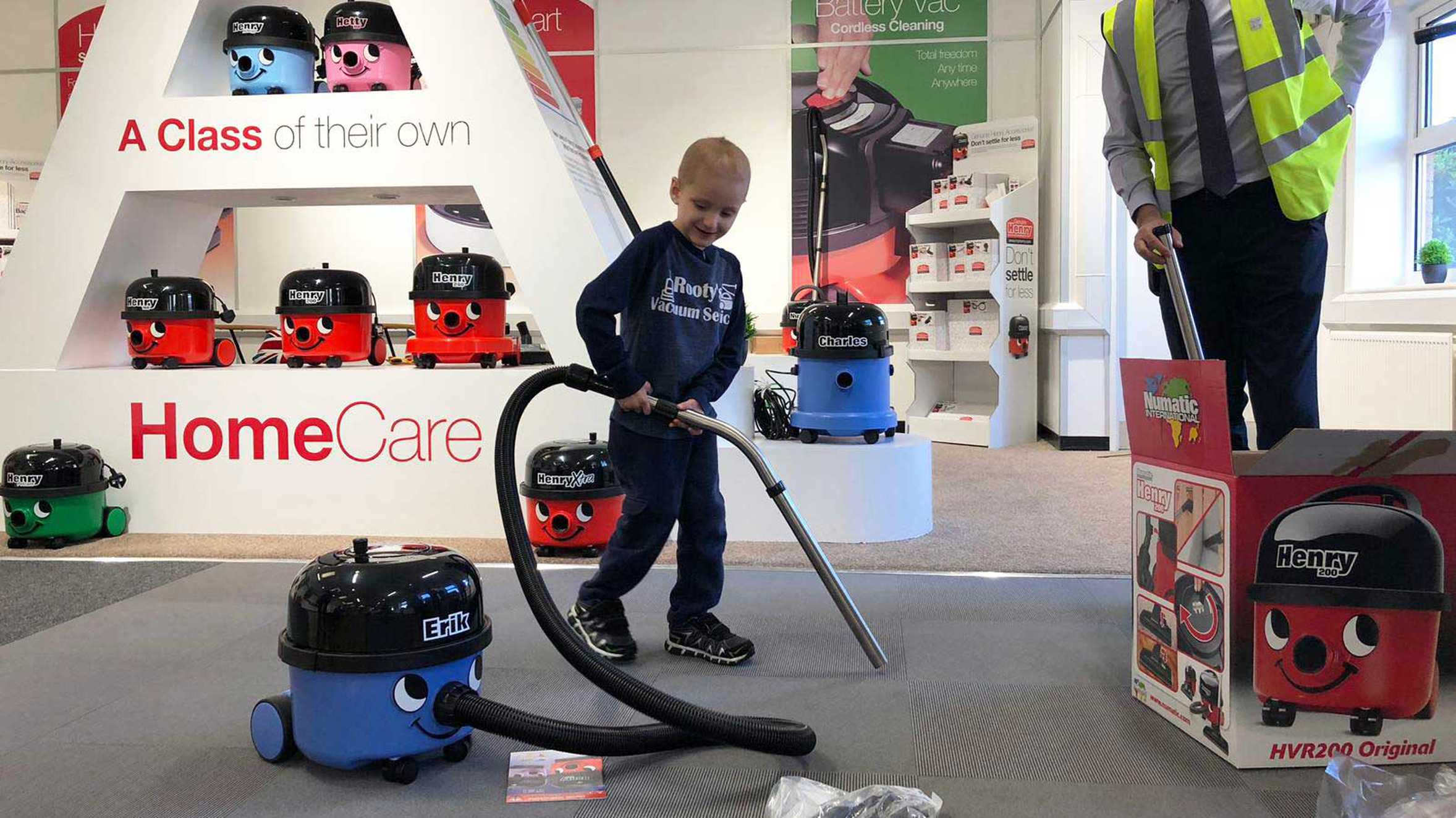Wish child, Erik playing with his new Henry vacuum cleaner