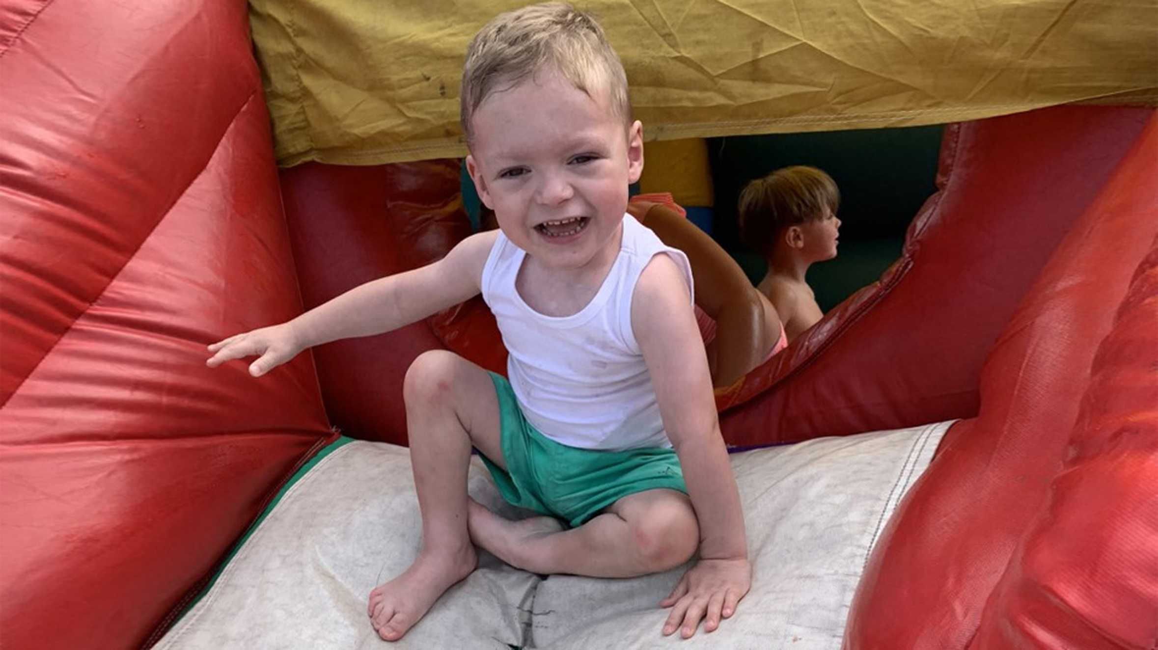 Frankie playing on an inflatable slide