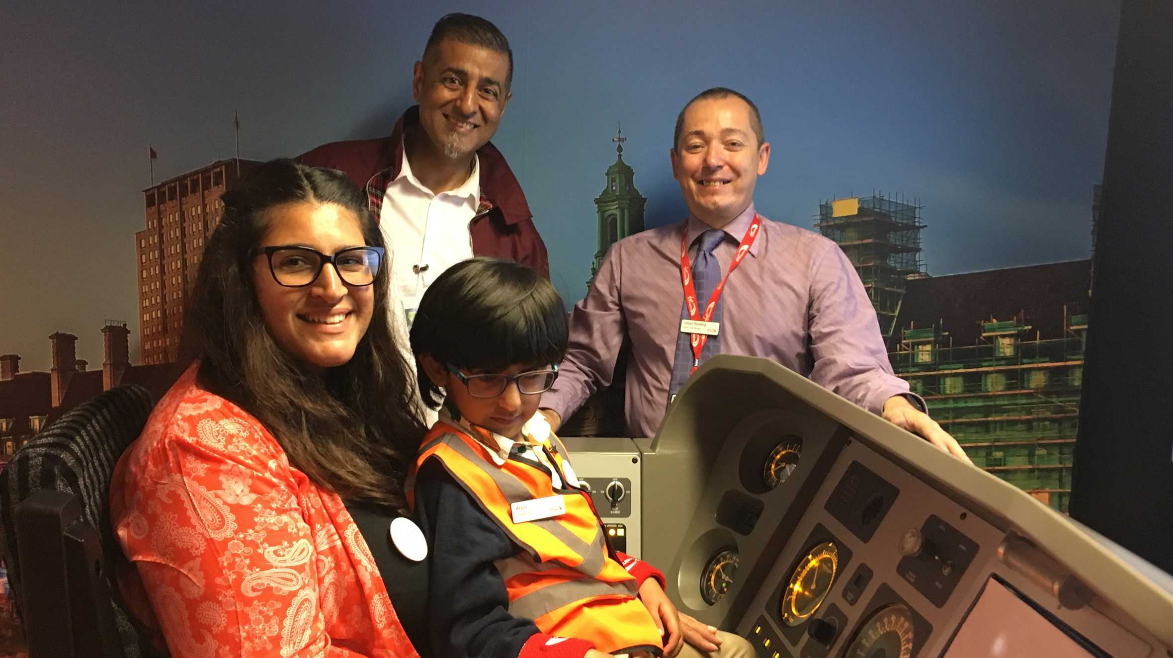 Arjun with his parents and Virgin staff member