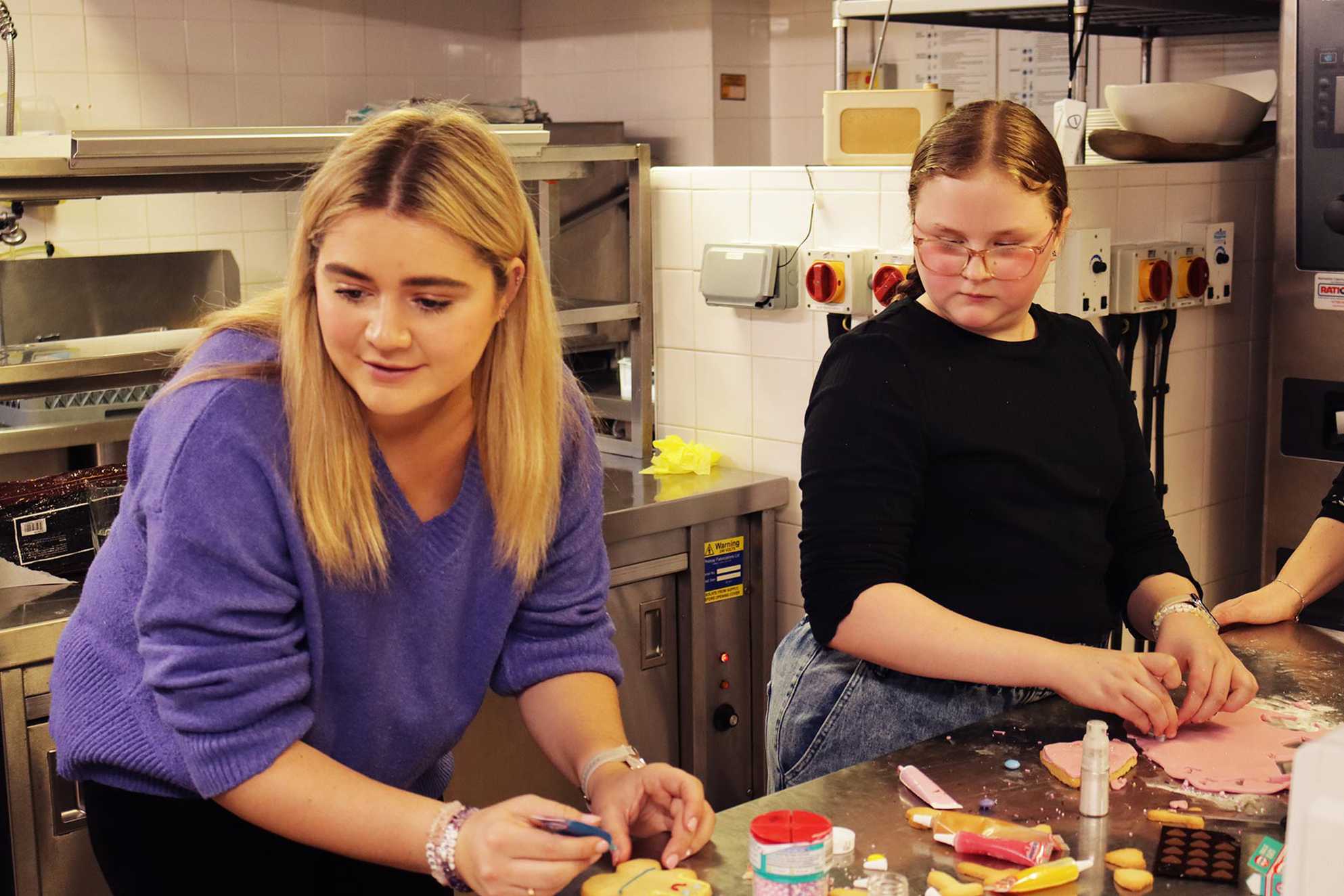 Abbie and Tilly hard at work in the kitchen.