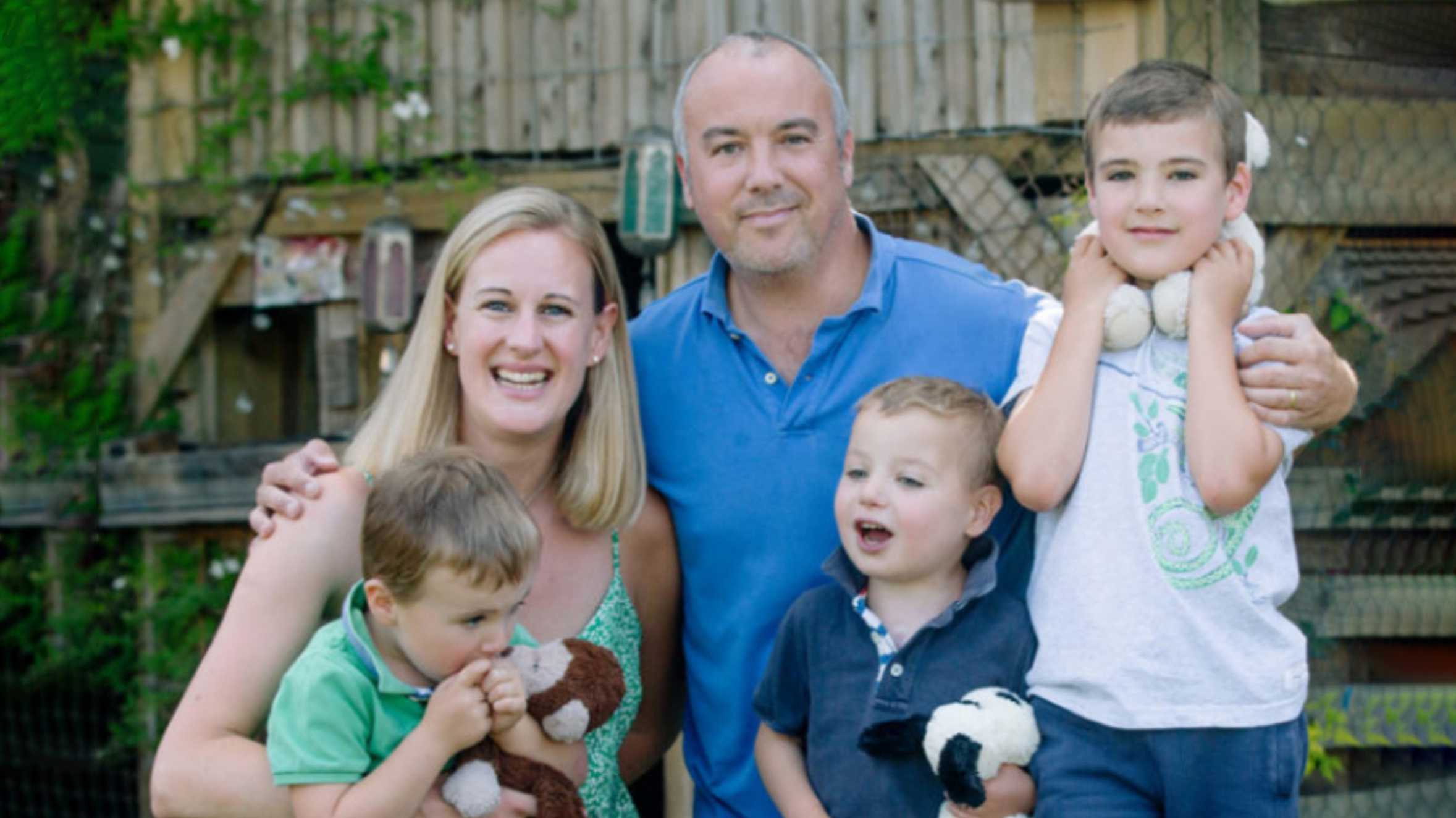 A family photo of Ollie with his mum, dad and two brothers.