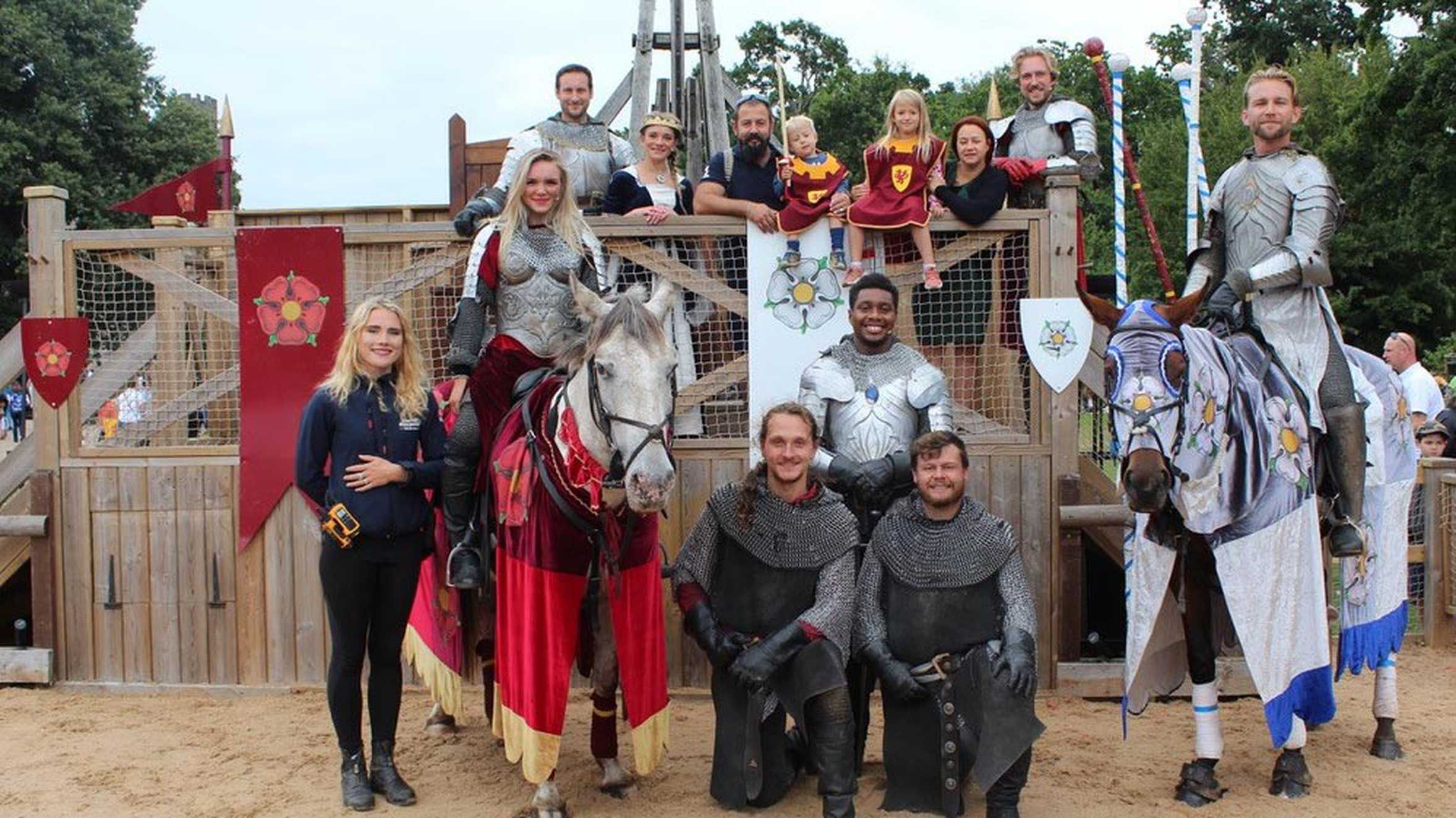 Hunor and his family posing for a group photo with the characters from his wish.