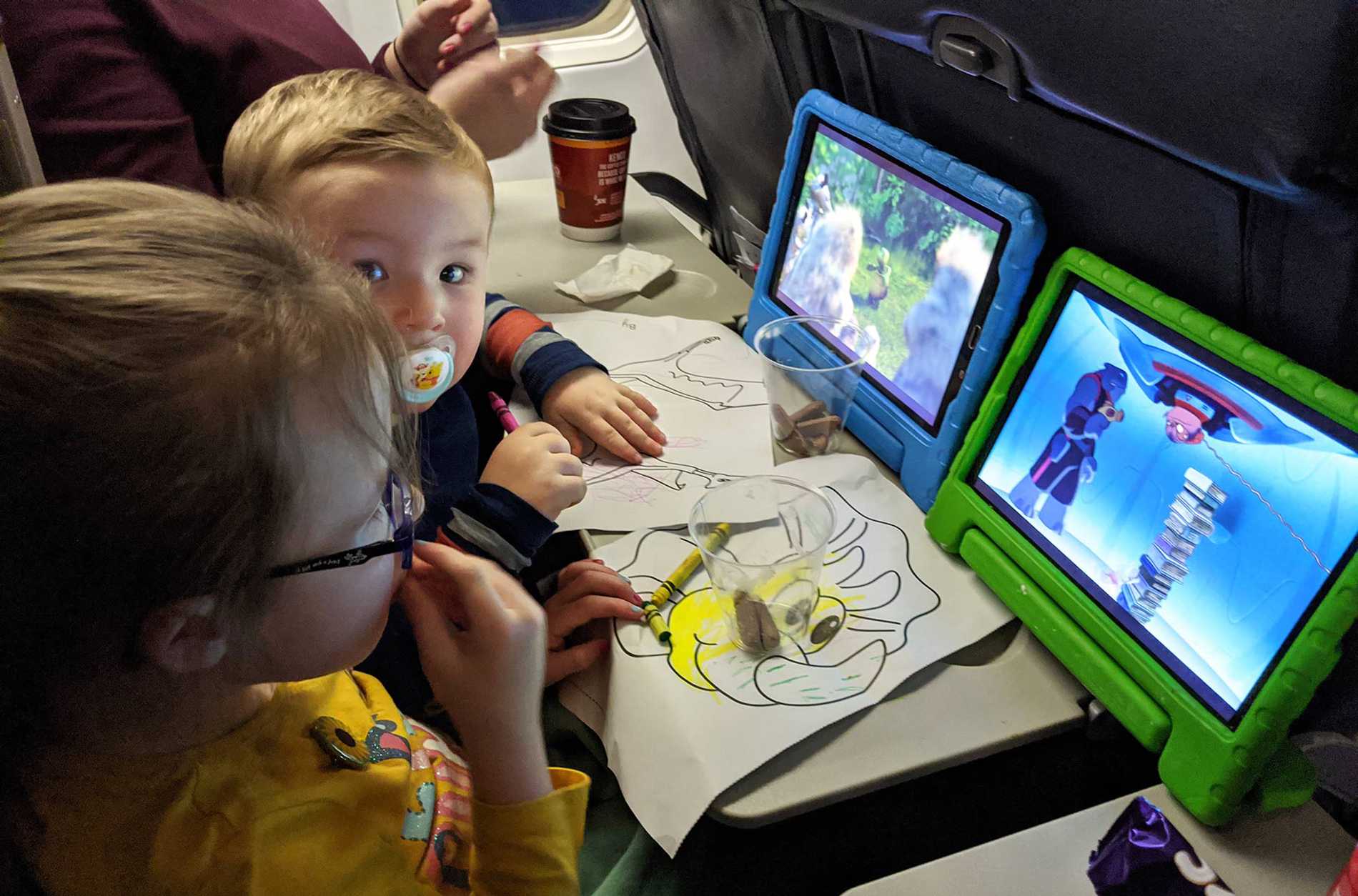 Hope and her brother watching videos on the plane, en-route to Lanzarote.