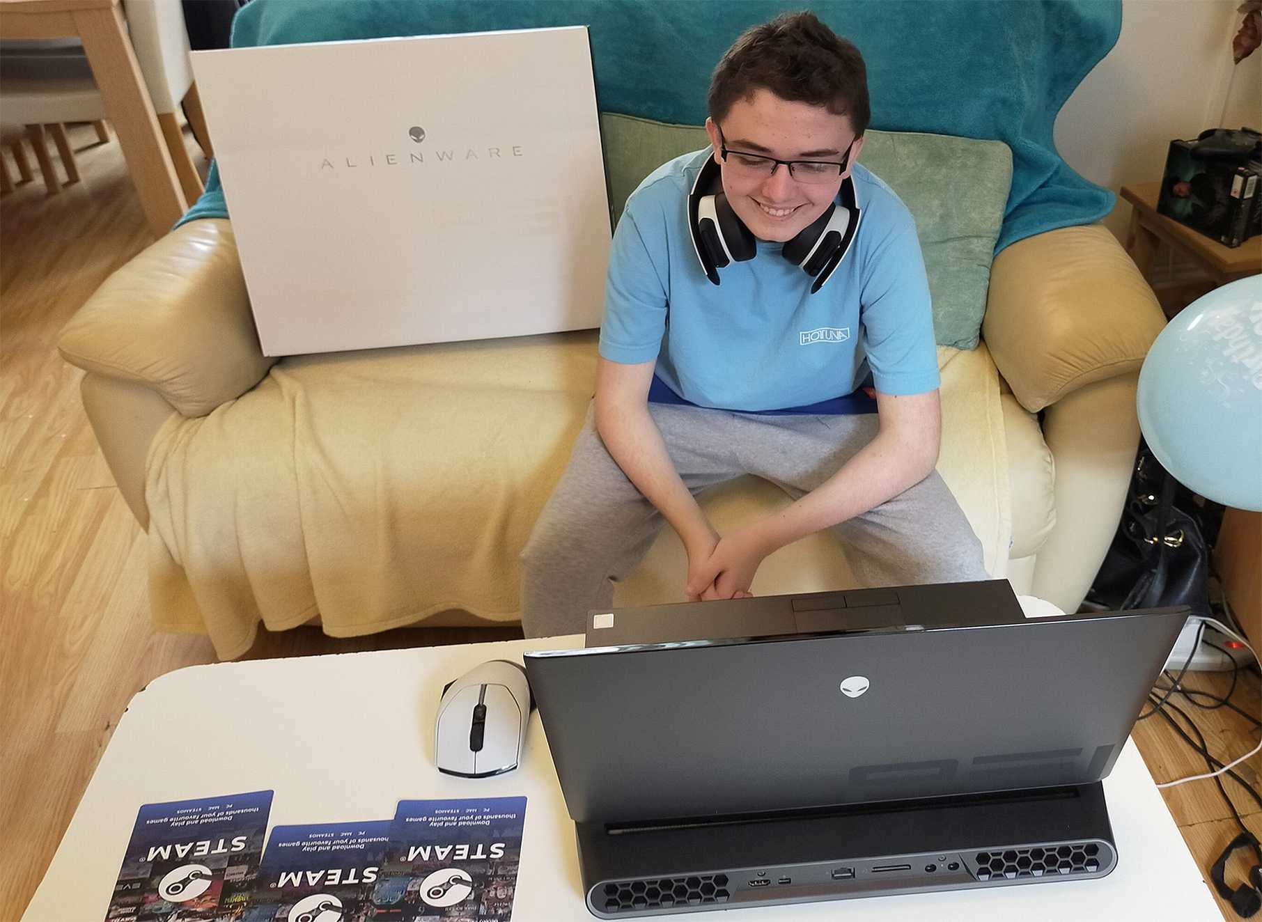 An excited Evan with his new Alienware gaming laptop.