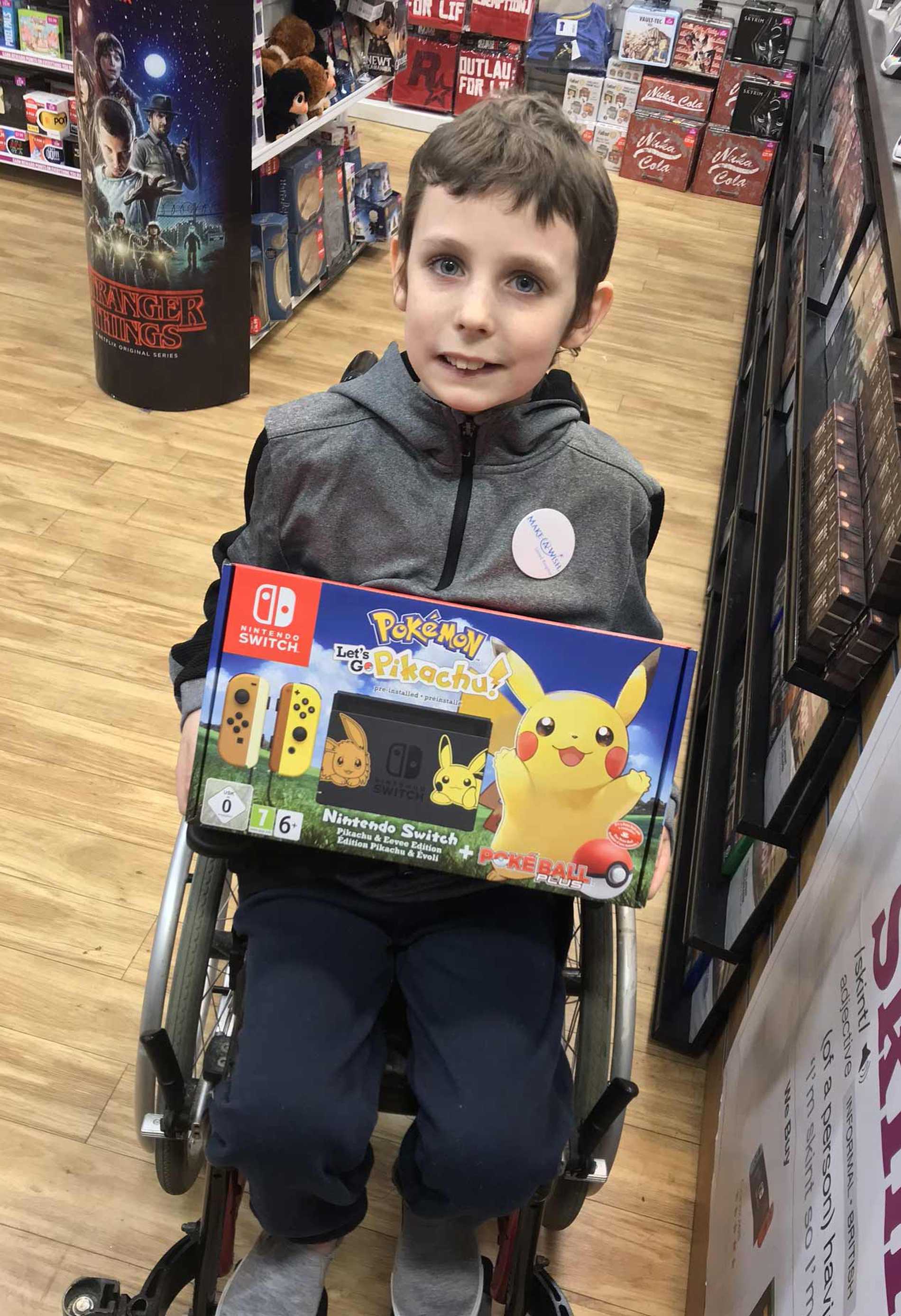 Charlie in the shops holding the Nintendo Switch