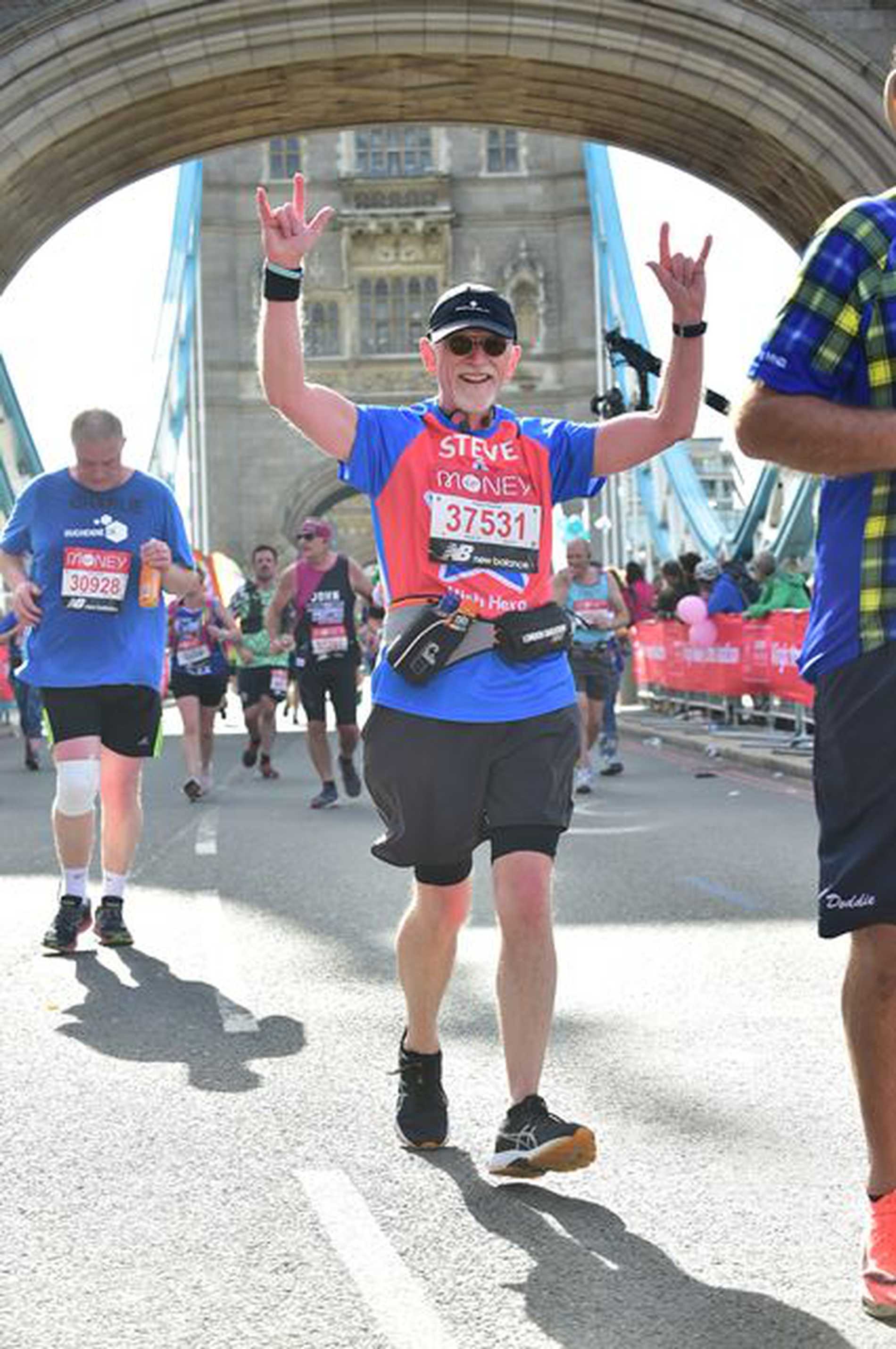 #WishHero, Steve running across Tower Bridge during the 2021 London Marathon.