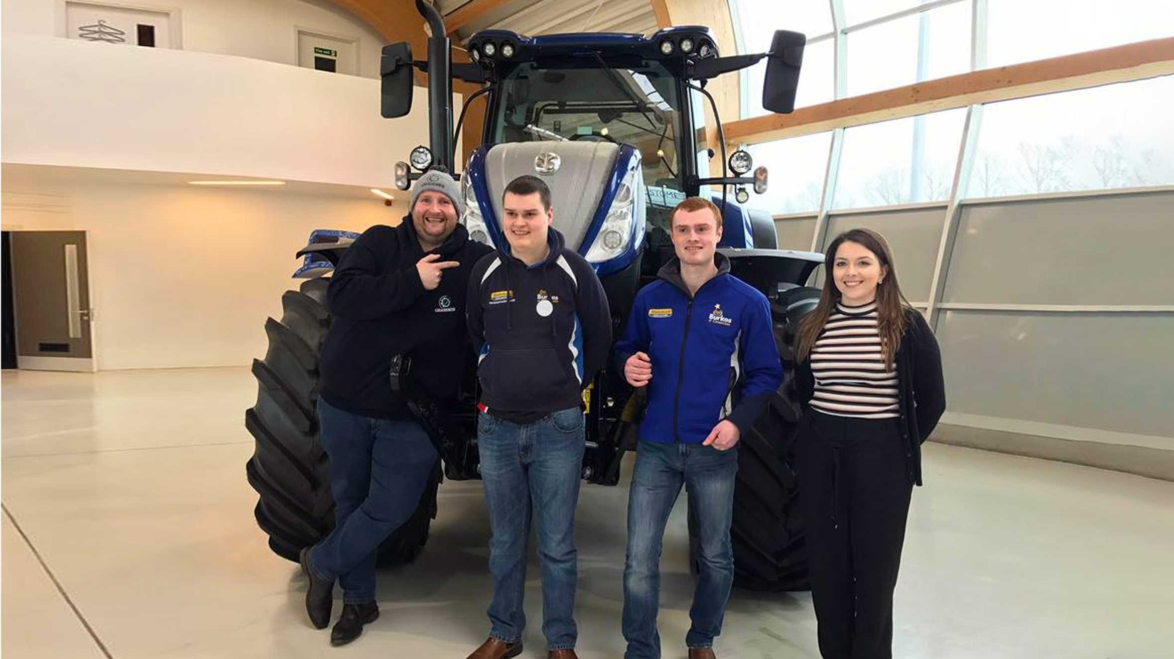 James standing in front of a tractor with Donkey from Grassmen