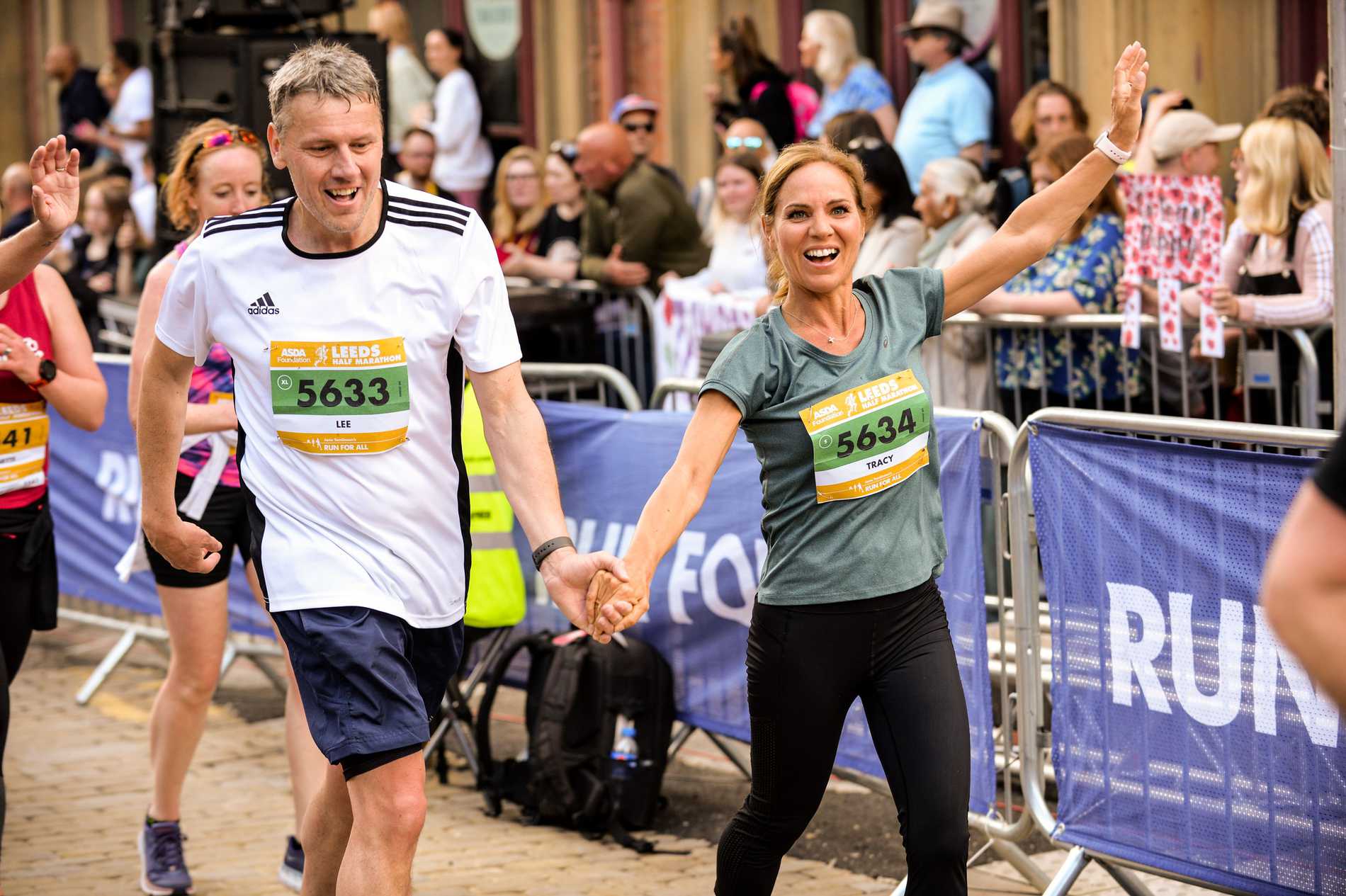 runners holding hands.jpeg