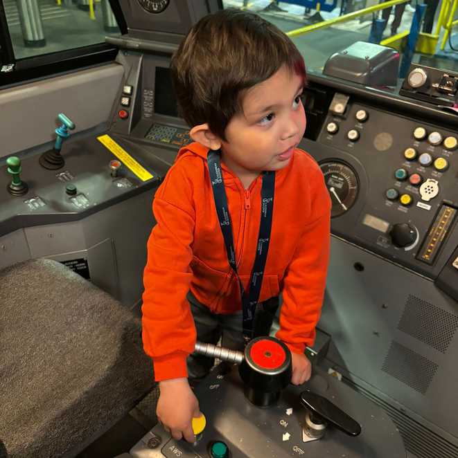 Everett plays with the controls in the control room of the sleeper train