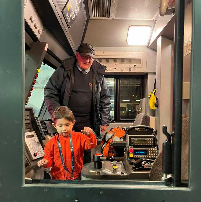 Everett being shown round the control room of the sleeper train