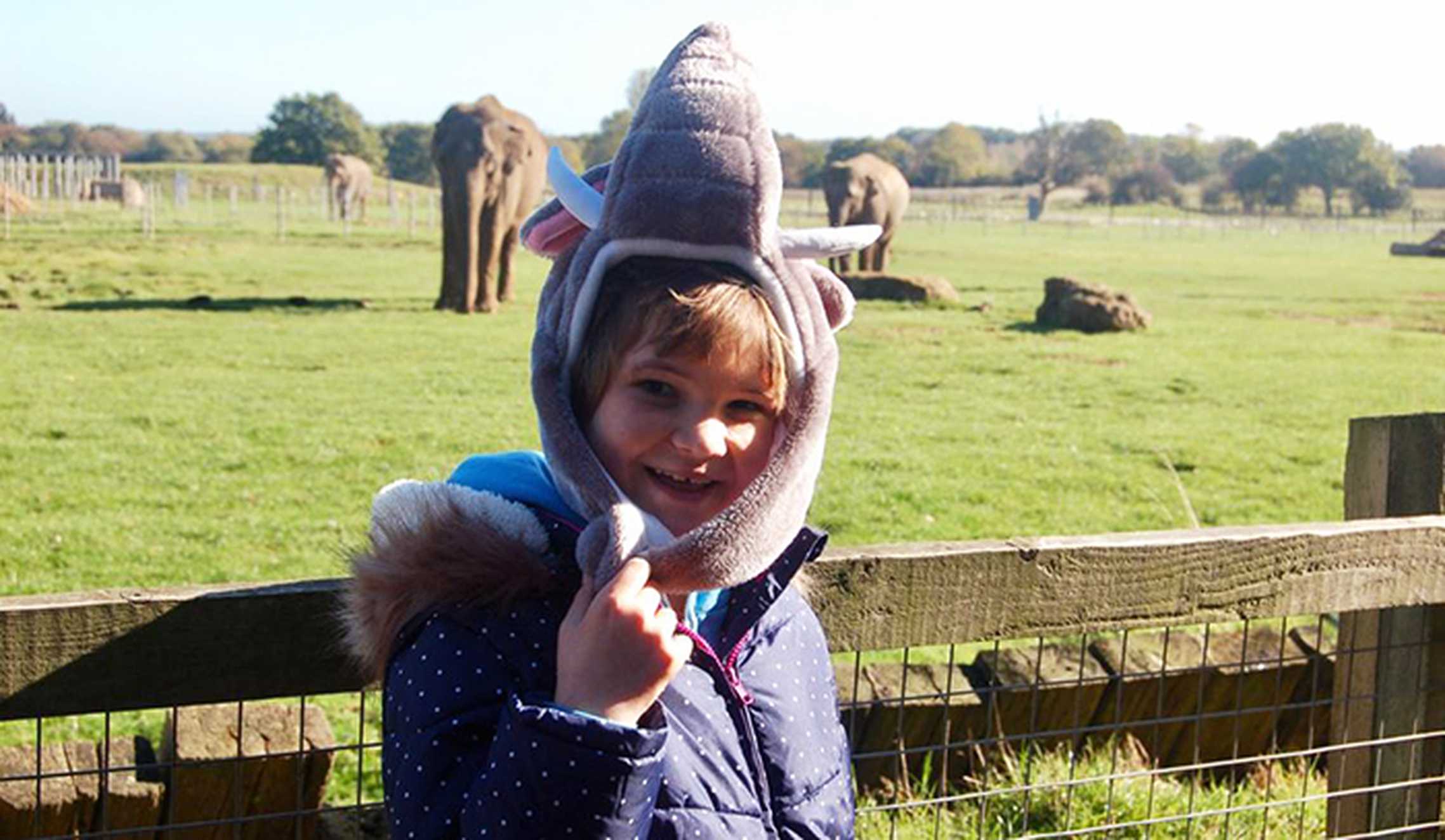 Florence at the zoo wearing her elephant hat