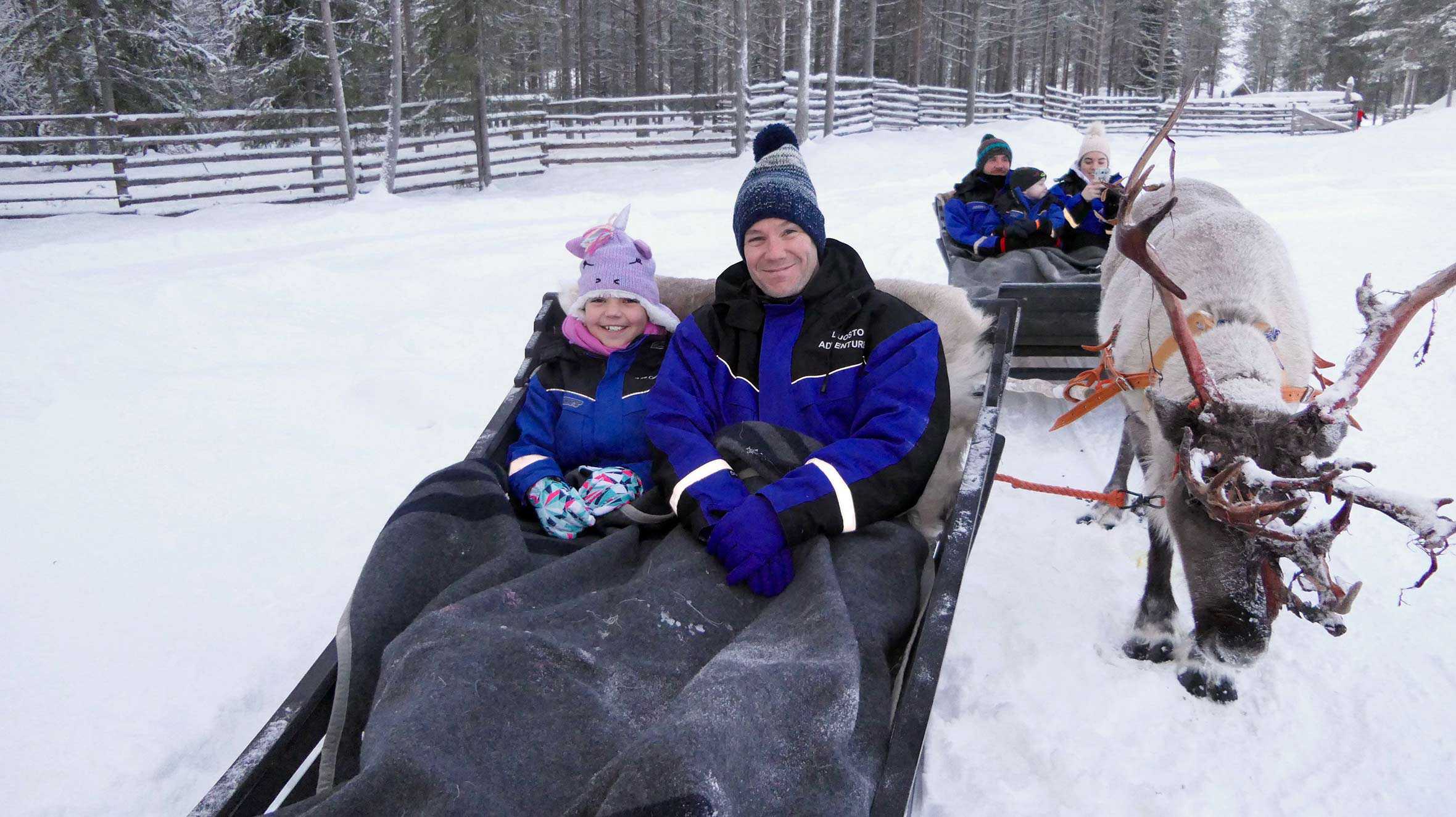 Wish child, Gracie and her dad enjoying a sleigh ride in Lapland.