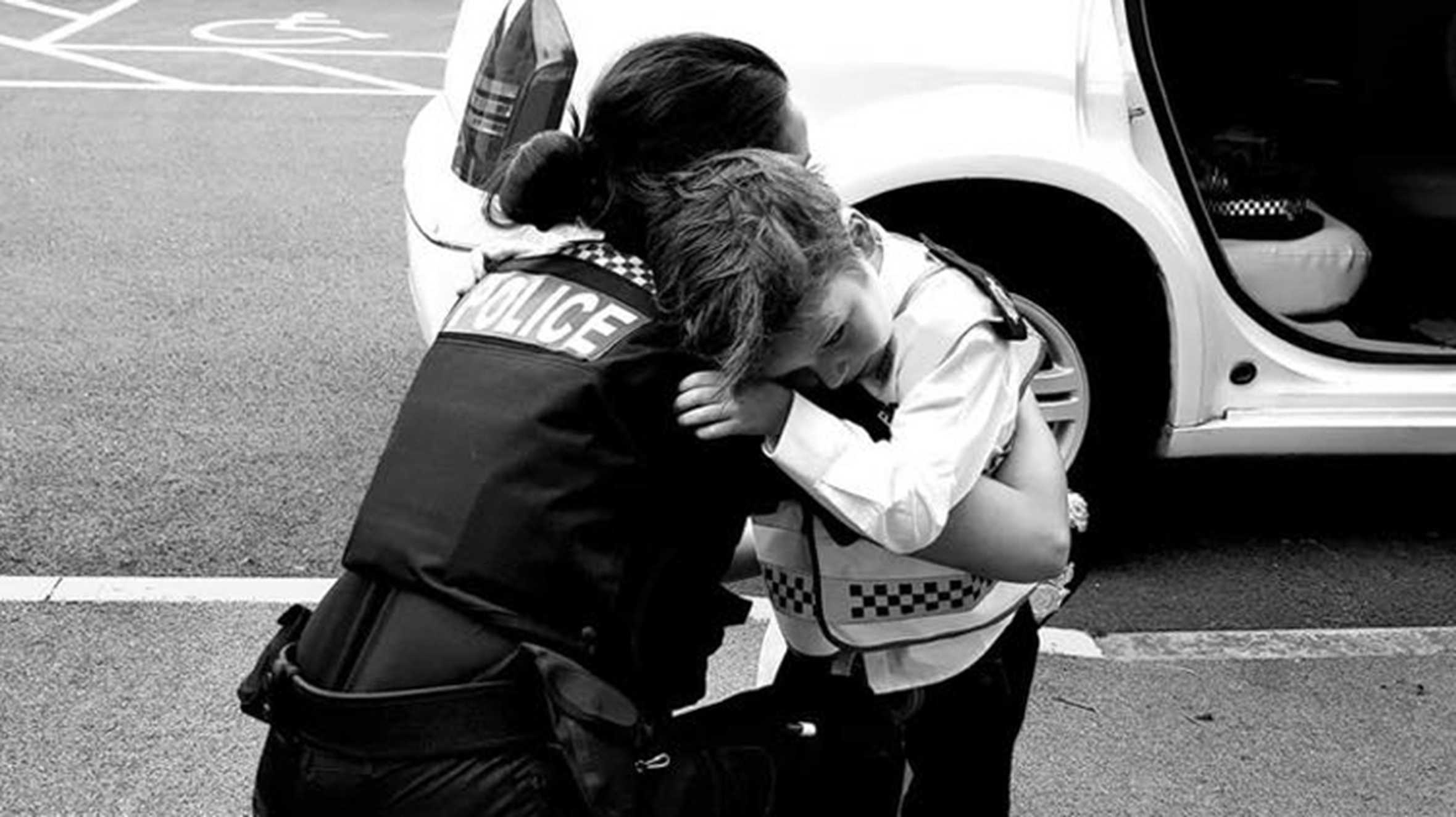 Danny hugging a female police officer