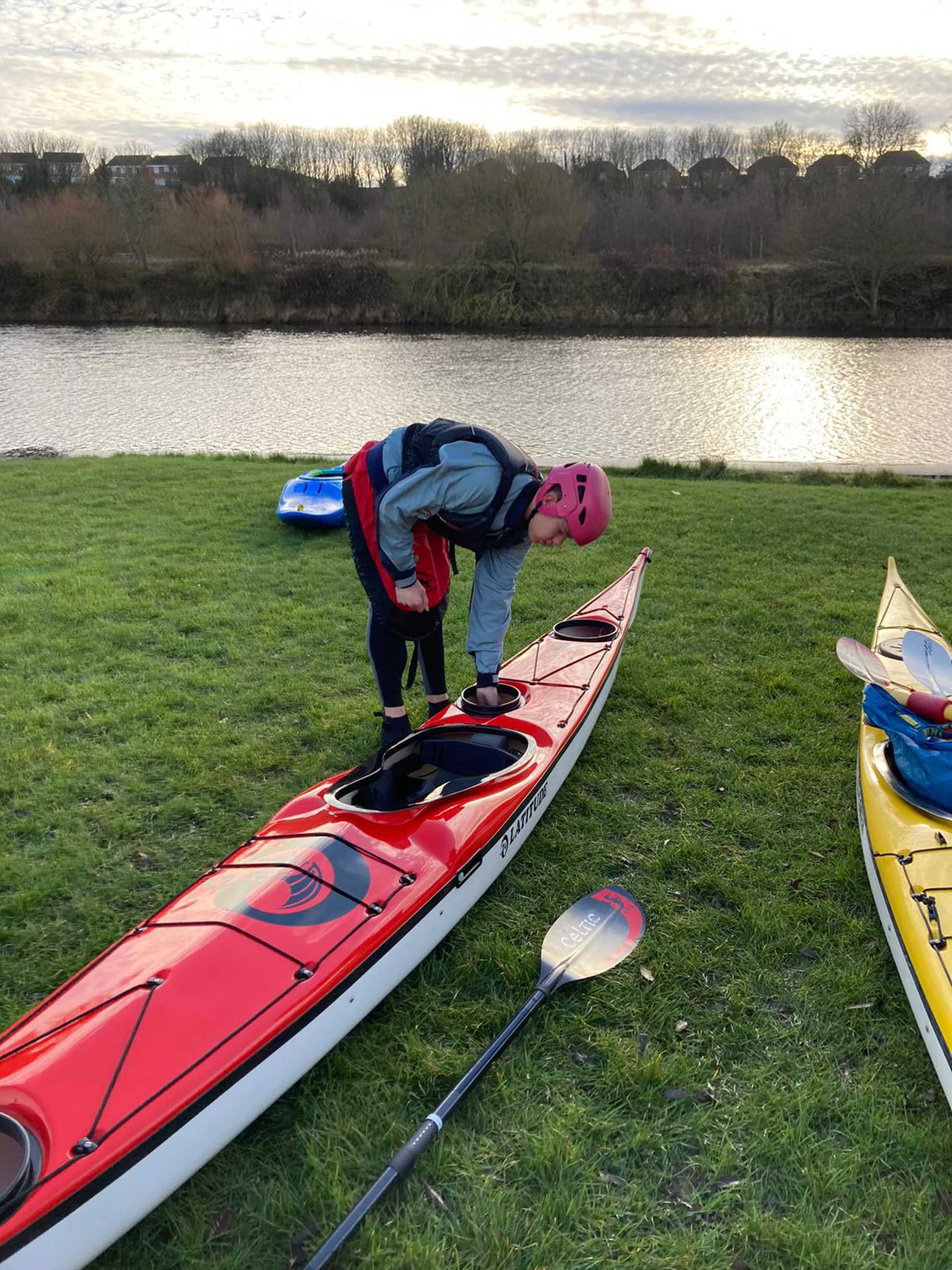 Sam getting his kayak ready to launch into the water.