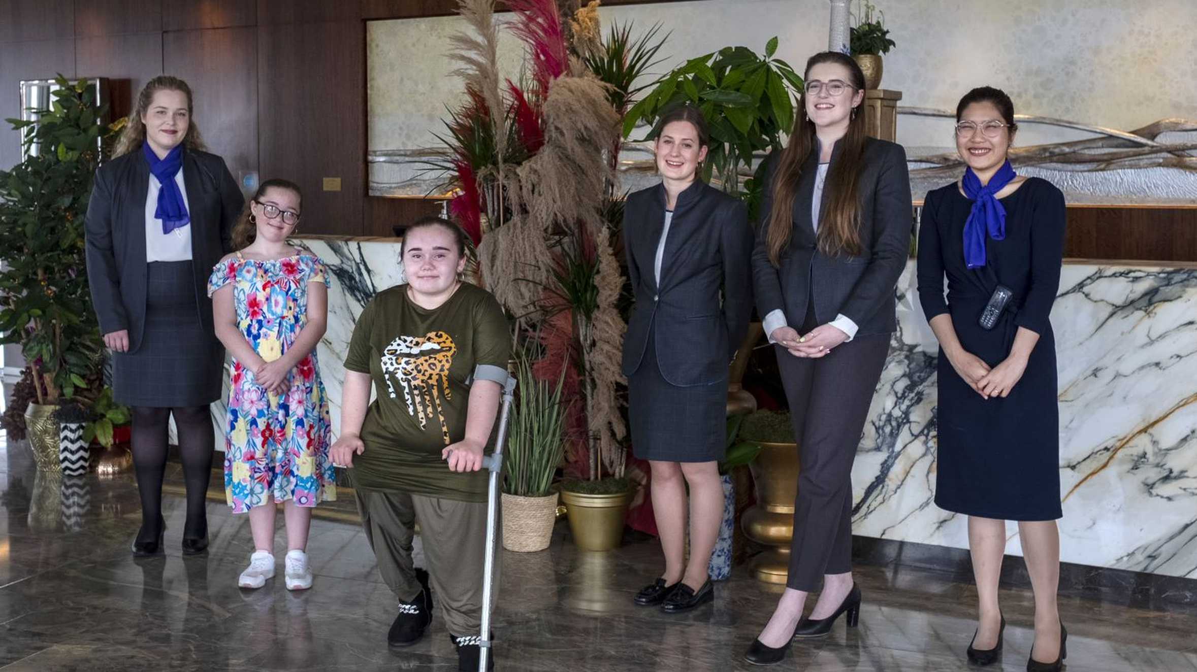 Angel and Mikayla with the hotel staff.