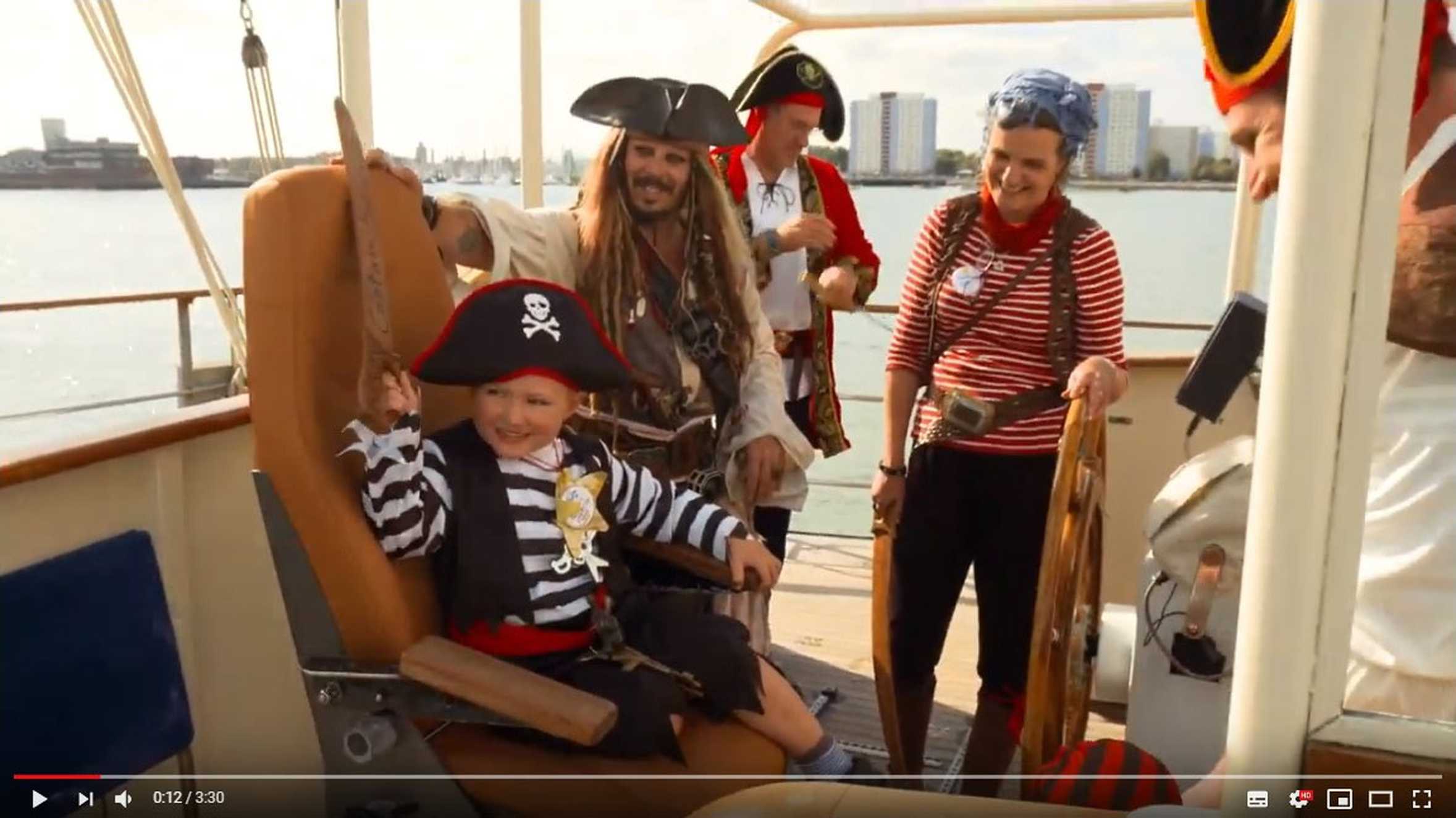 Sebbie and his family on the pirate ship during his wish to have a pirate party