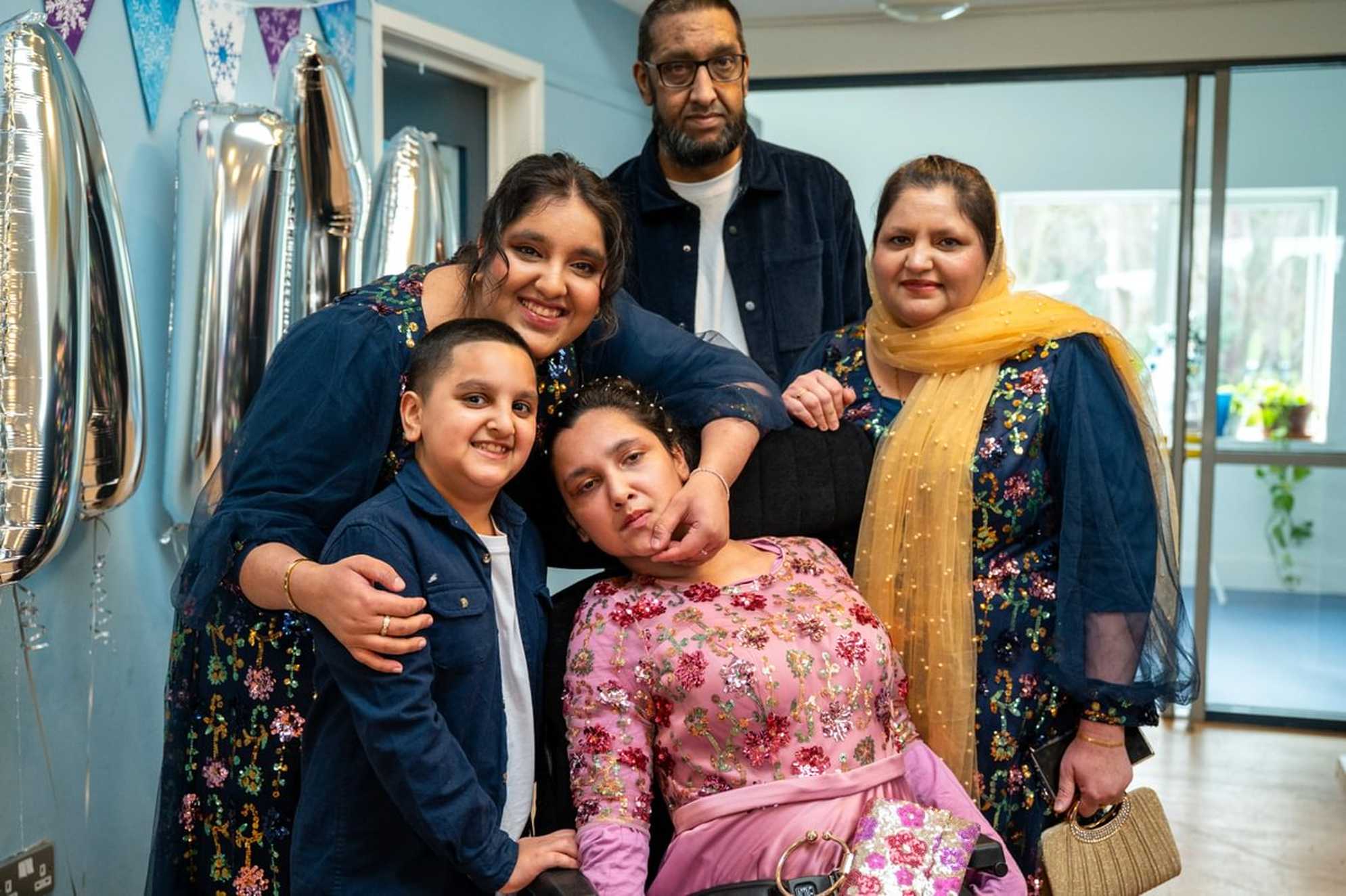 A group photo of Sumaiya and her family