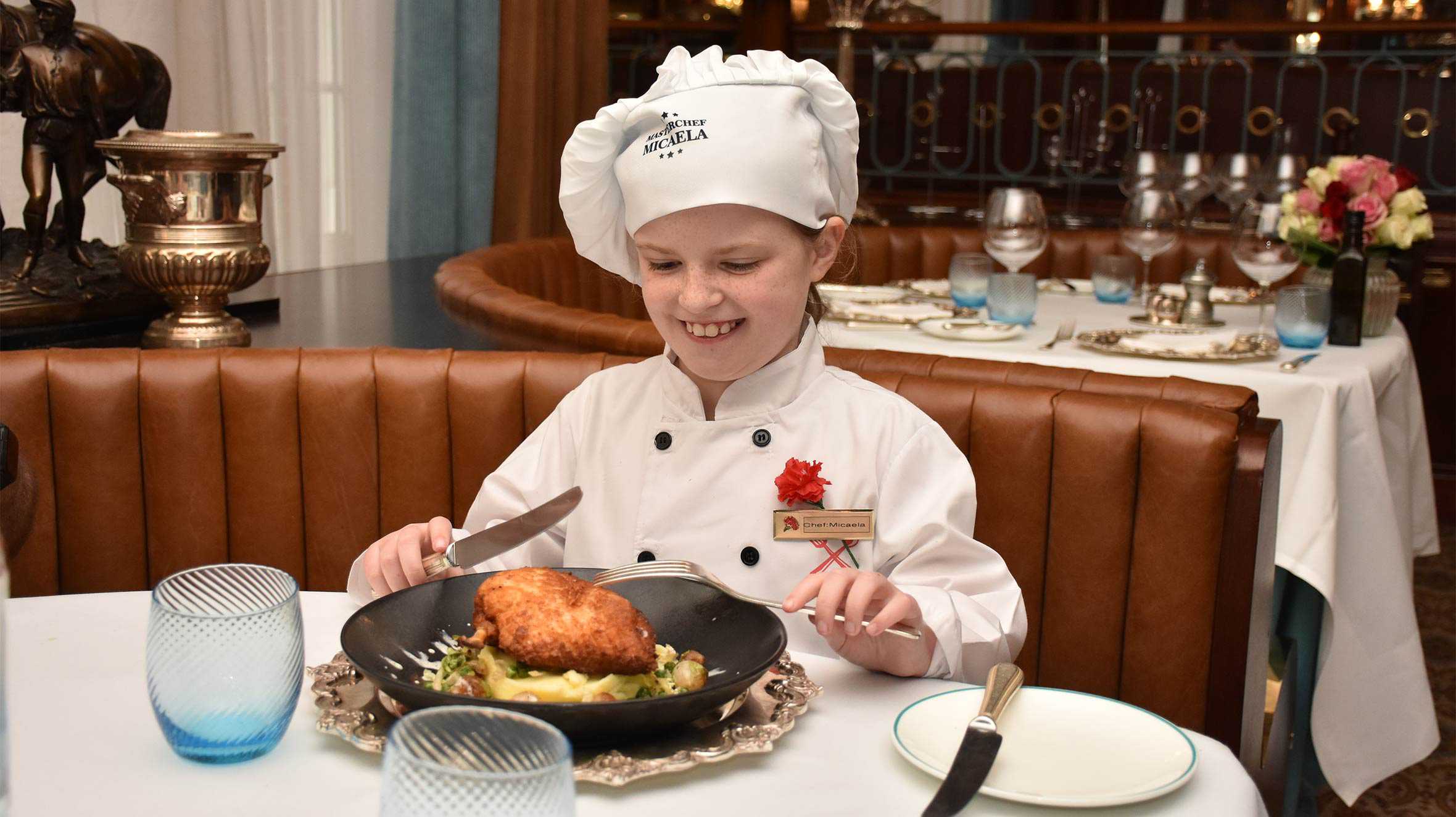 Micaela enjoying the dish she prepared in the hotel's restaurant.