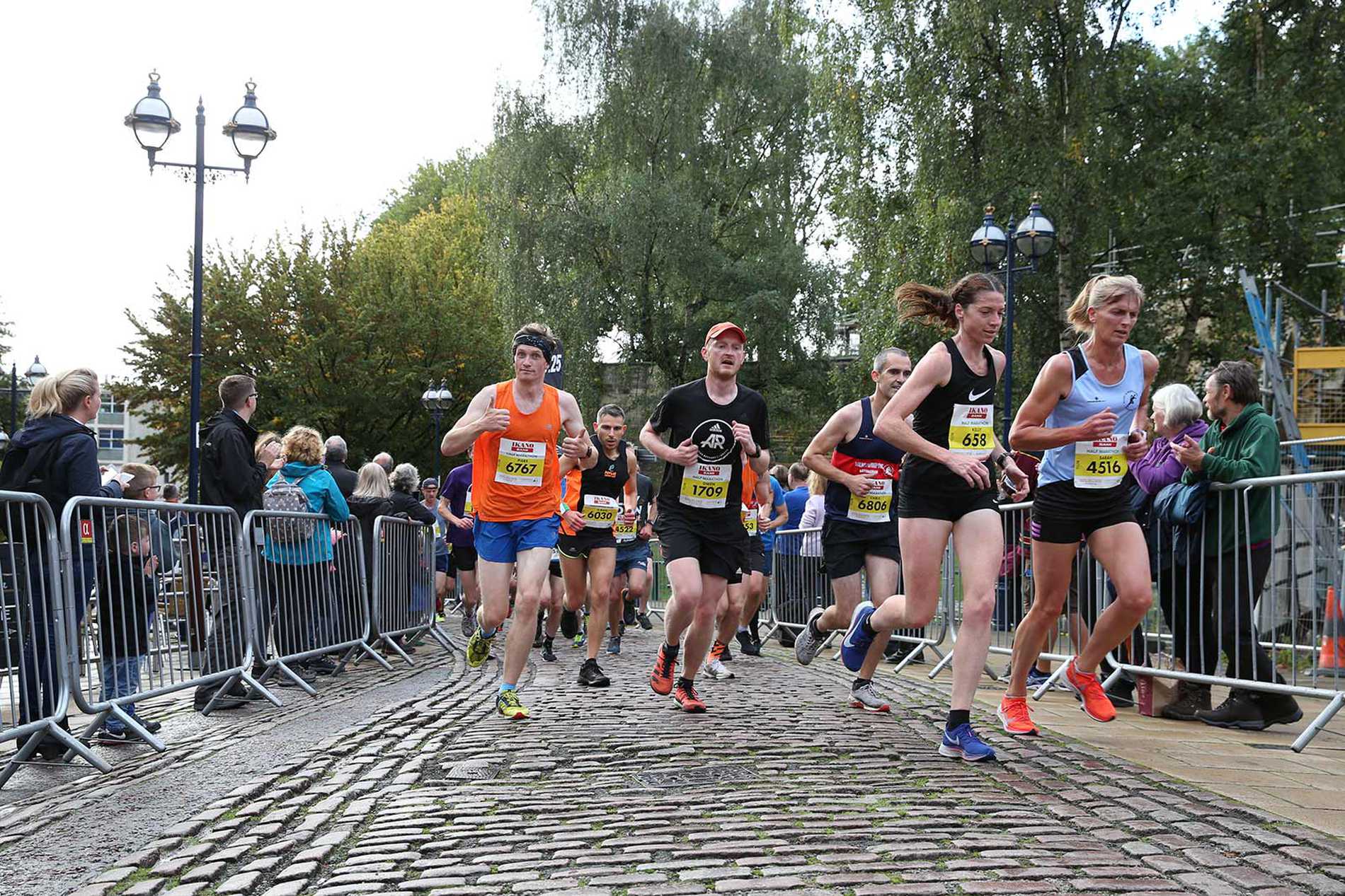 Runners carefully making their way along one of Nottingham's cobbled streets during the Robin Hood Half Marathon.