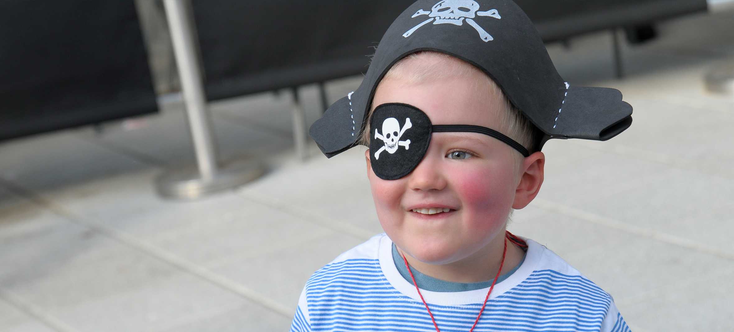 Sebbie with his eye patch and pirate hat ready for his pirate-themed wish