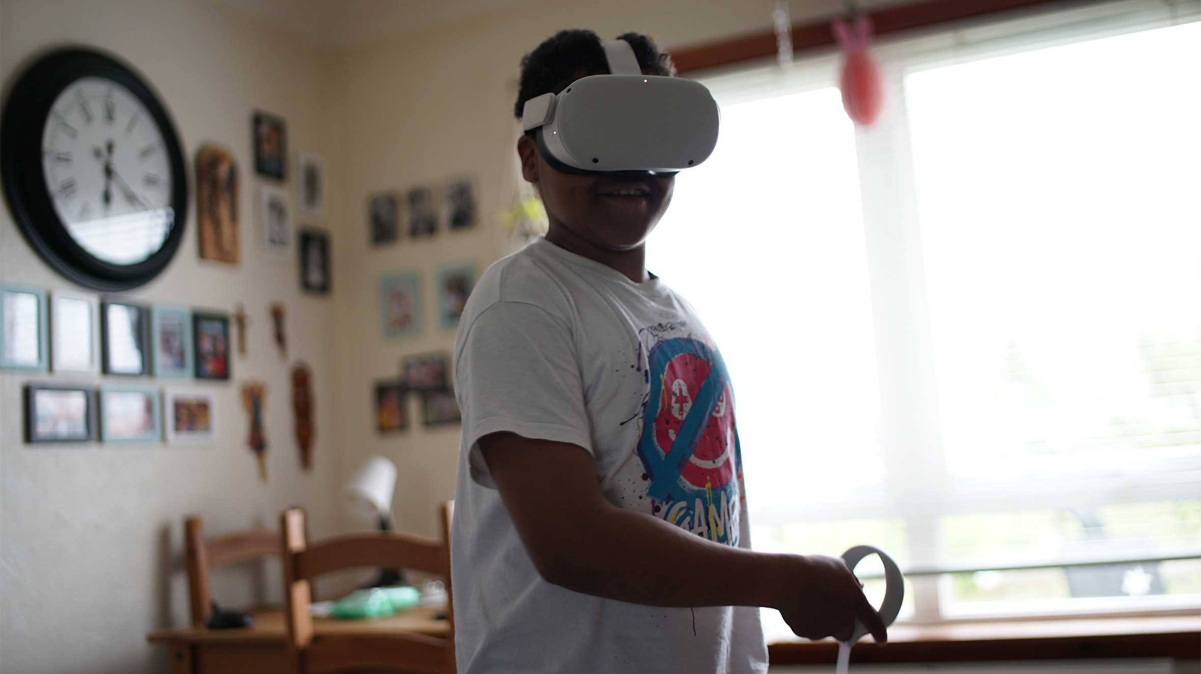 Lukasz, playing a game with his VR headset on.