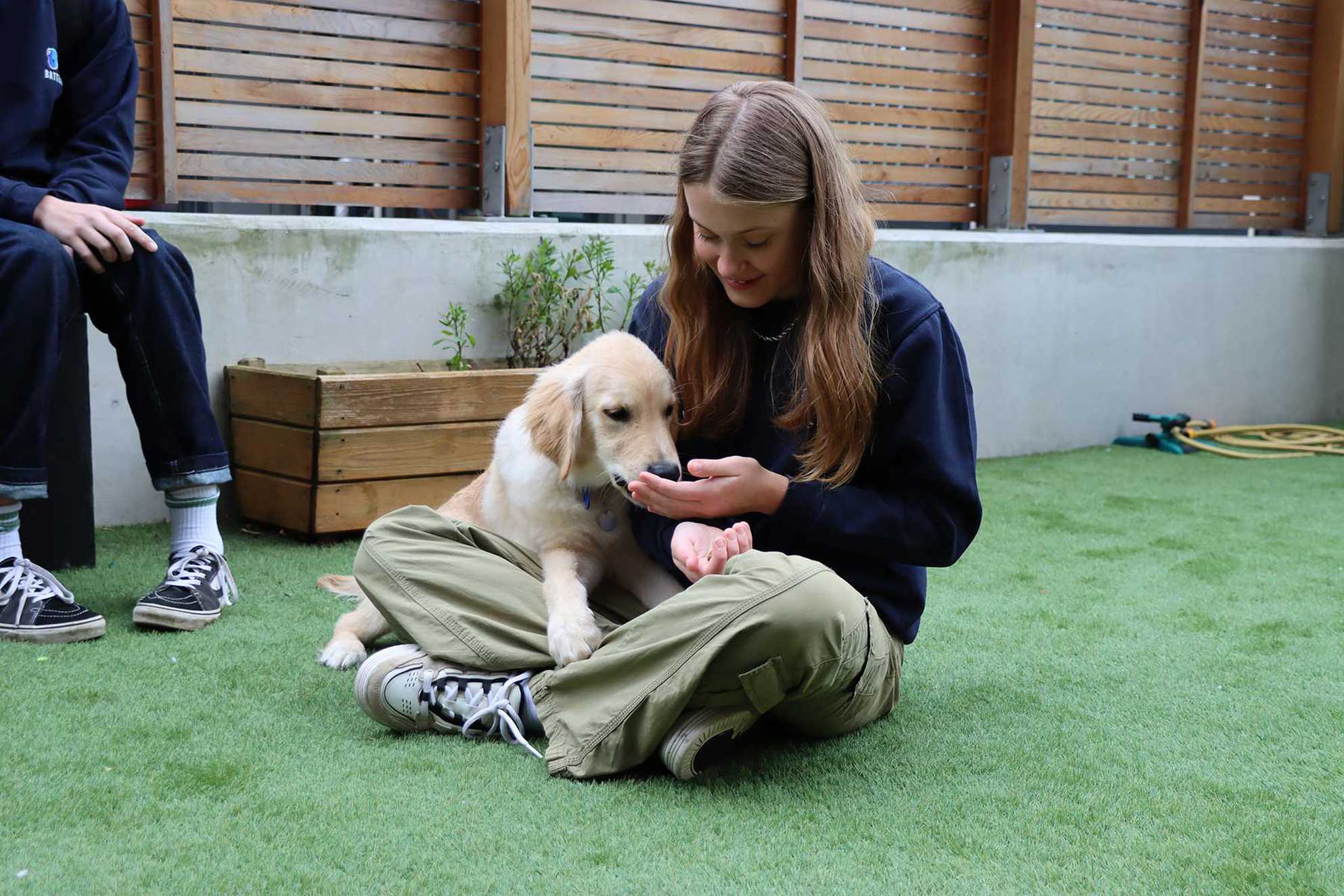 Leila with Golden Retriever puppy, Louie.