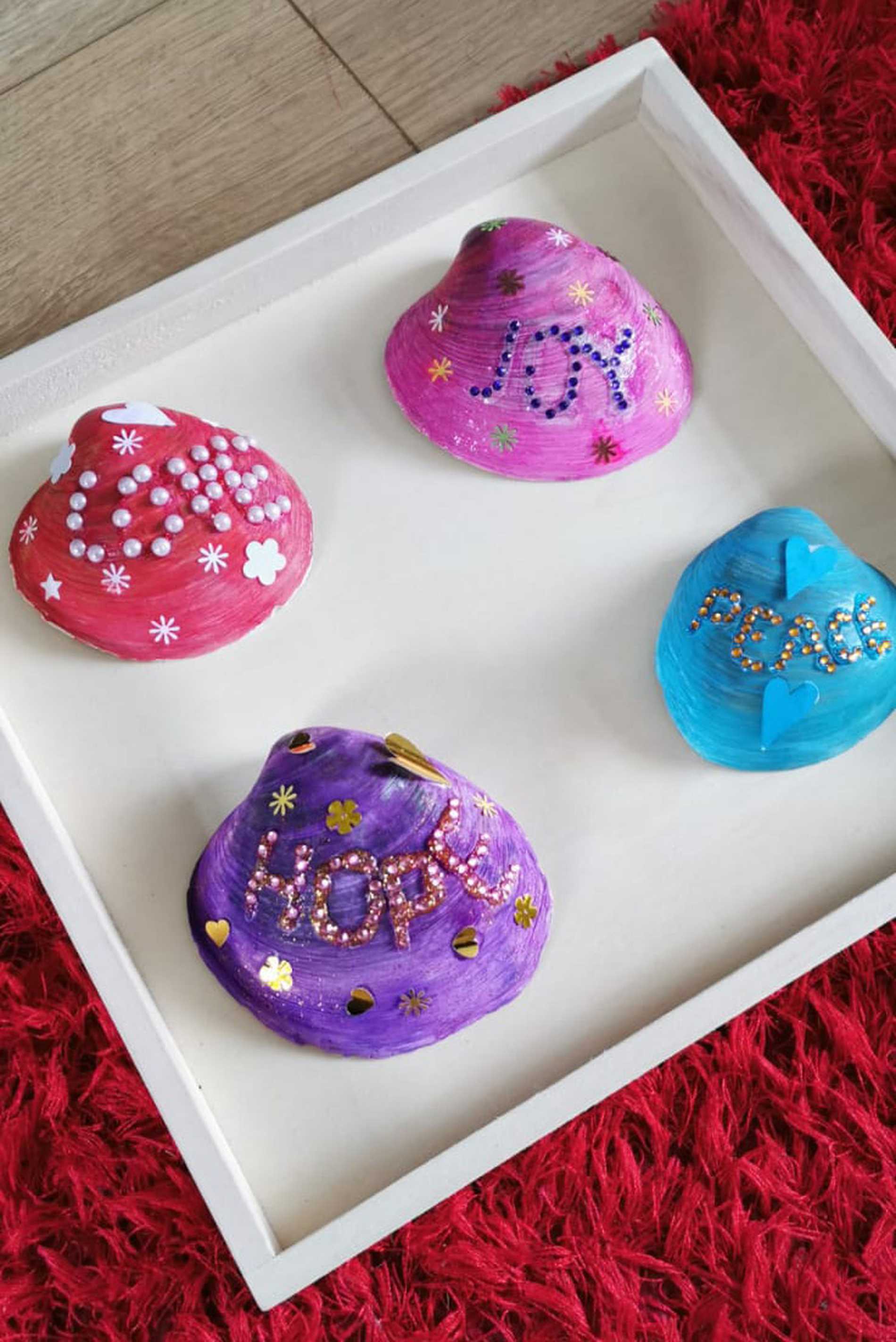 Some colourful painted and decorated shells, Bethany created with her new art station.