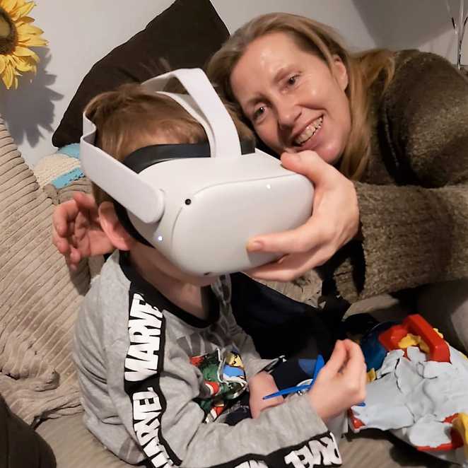 Aiden and his mum playing with his virtual reality headset.