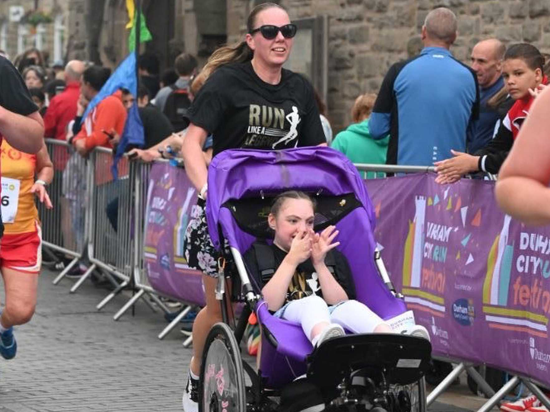 Jo and Alice taking part in a run together.