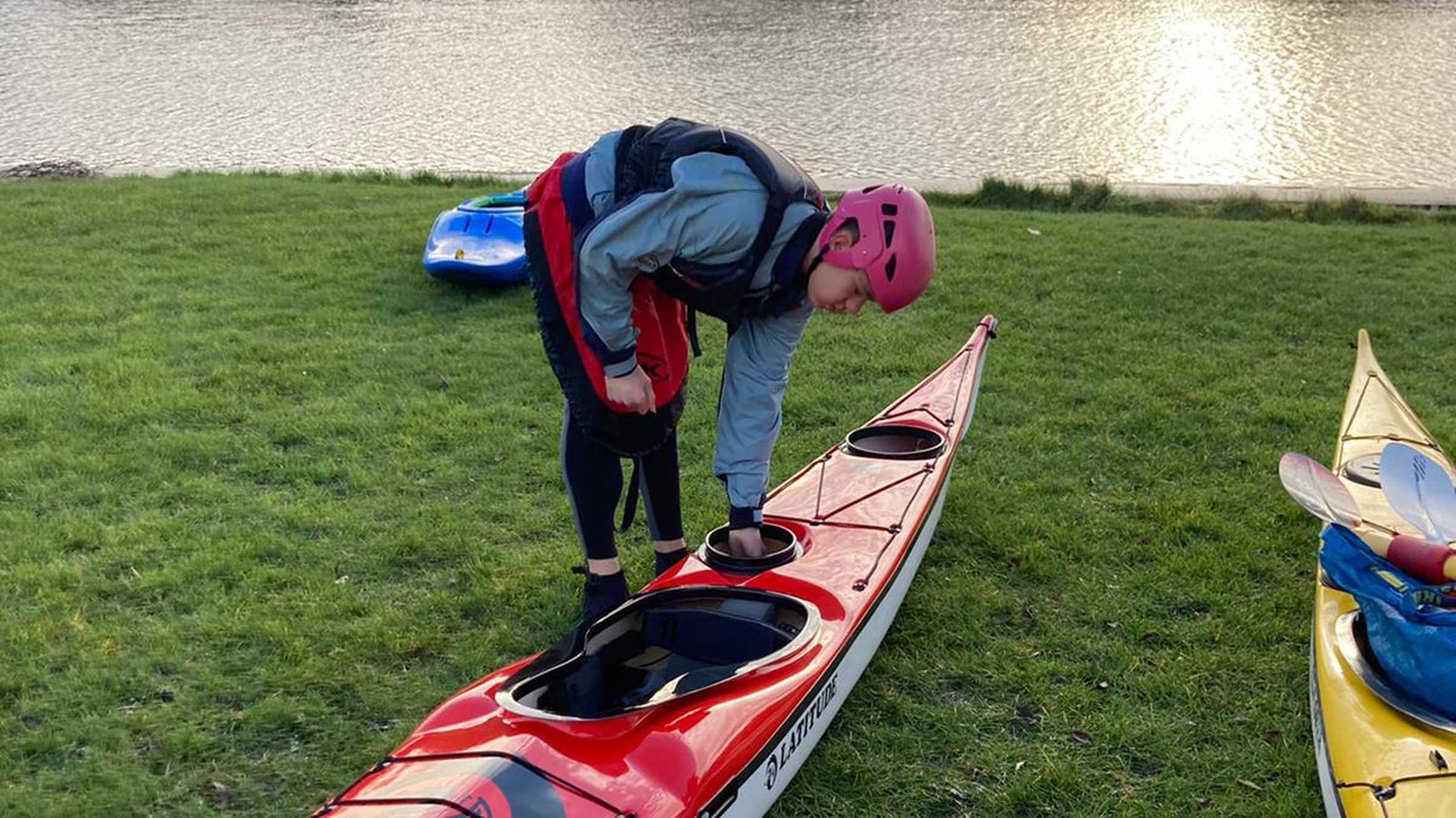 Sam getting his kayak ready to launch into the water.