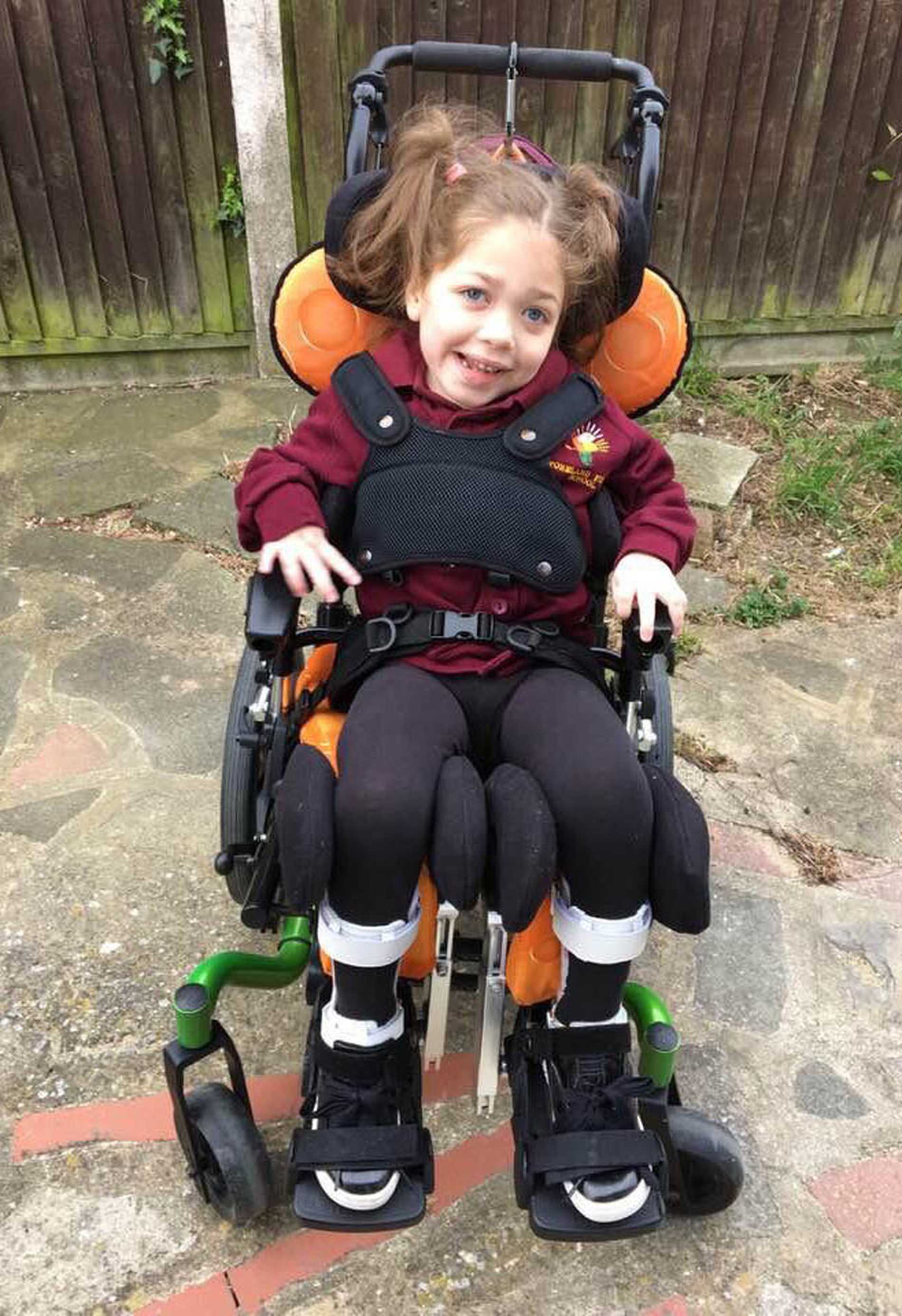 Aubree smiling in her wheelchair