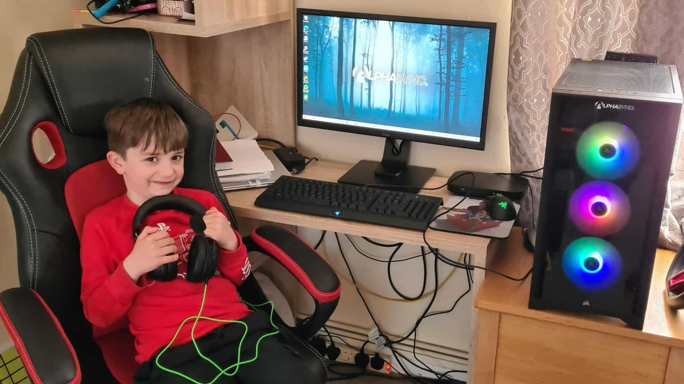 Aiden with his new gaming PC.