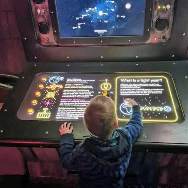 Aiden interacting with one of the displays at the Winchester Science Museum.