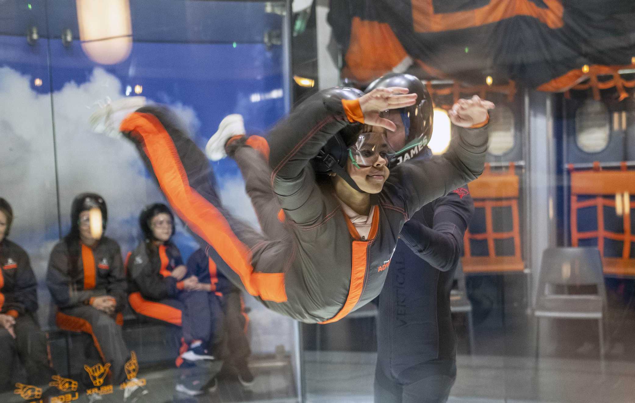 A former wish child trying their hand at indoor skydiving at Bear Grylls Adventure Park.