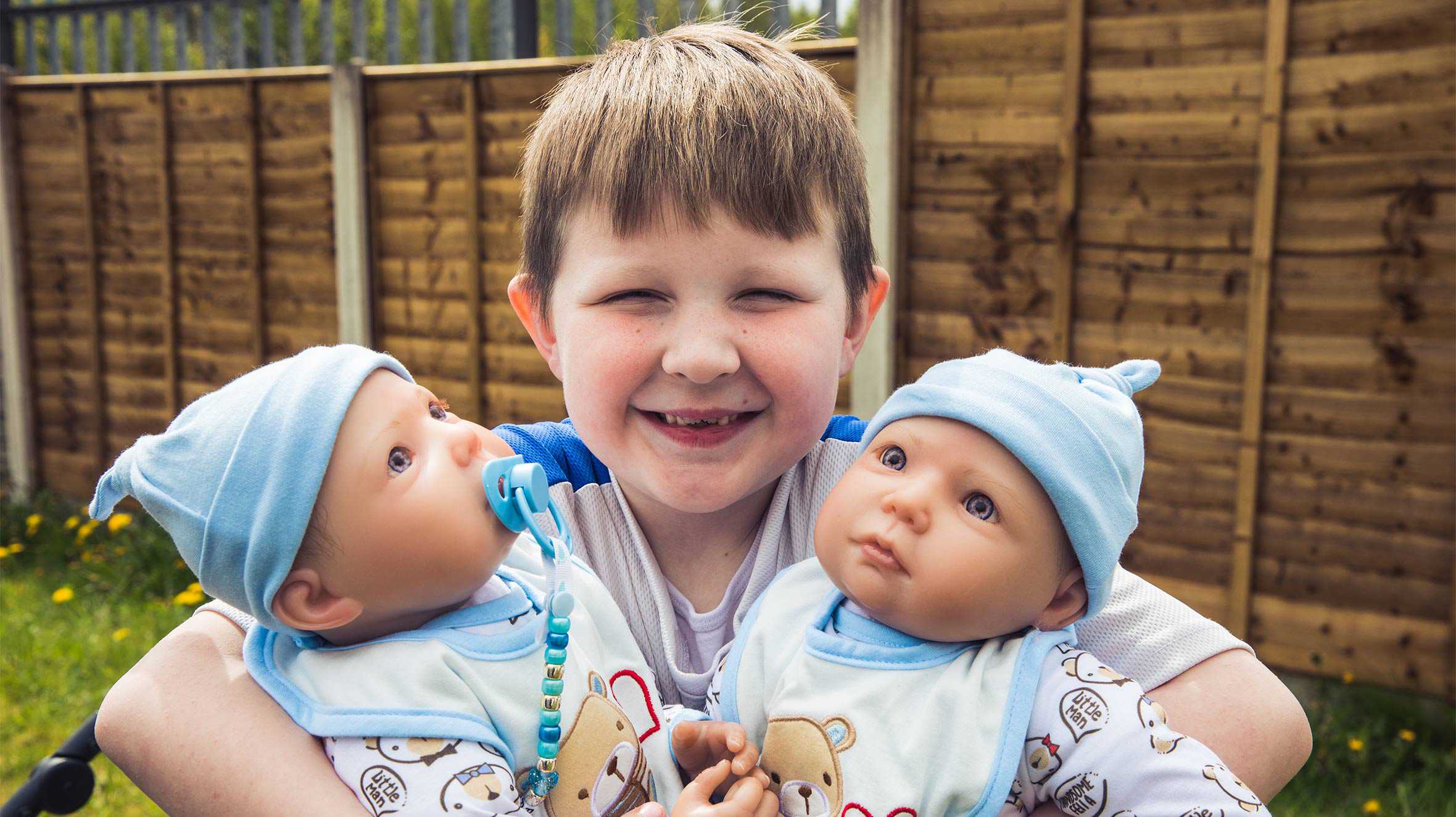 Andrew proudly holding his two 'babies'