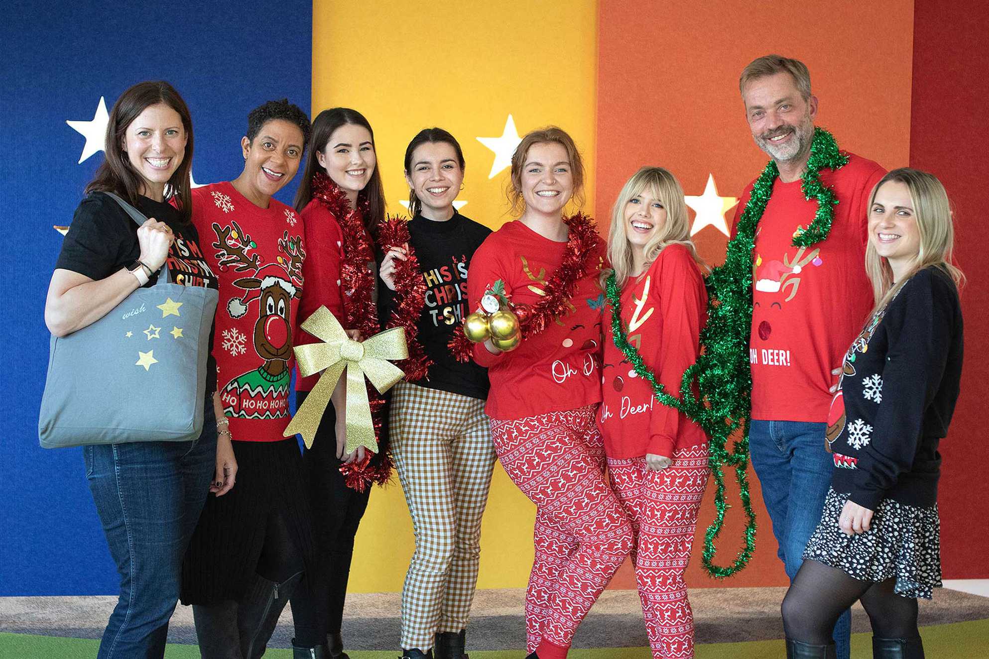 Member's of the Make-A-Wish team wearing some of the Peacocks Christmas 2022 clothing range.