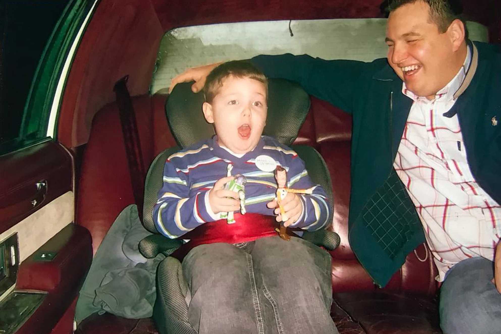 Jacob and his dad in the back of the limo on the way to his wish.