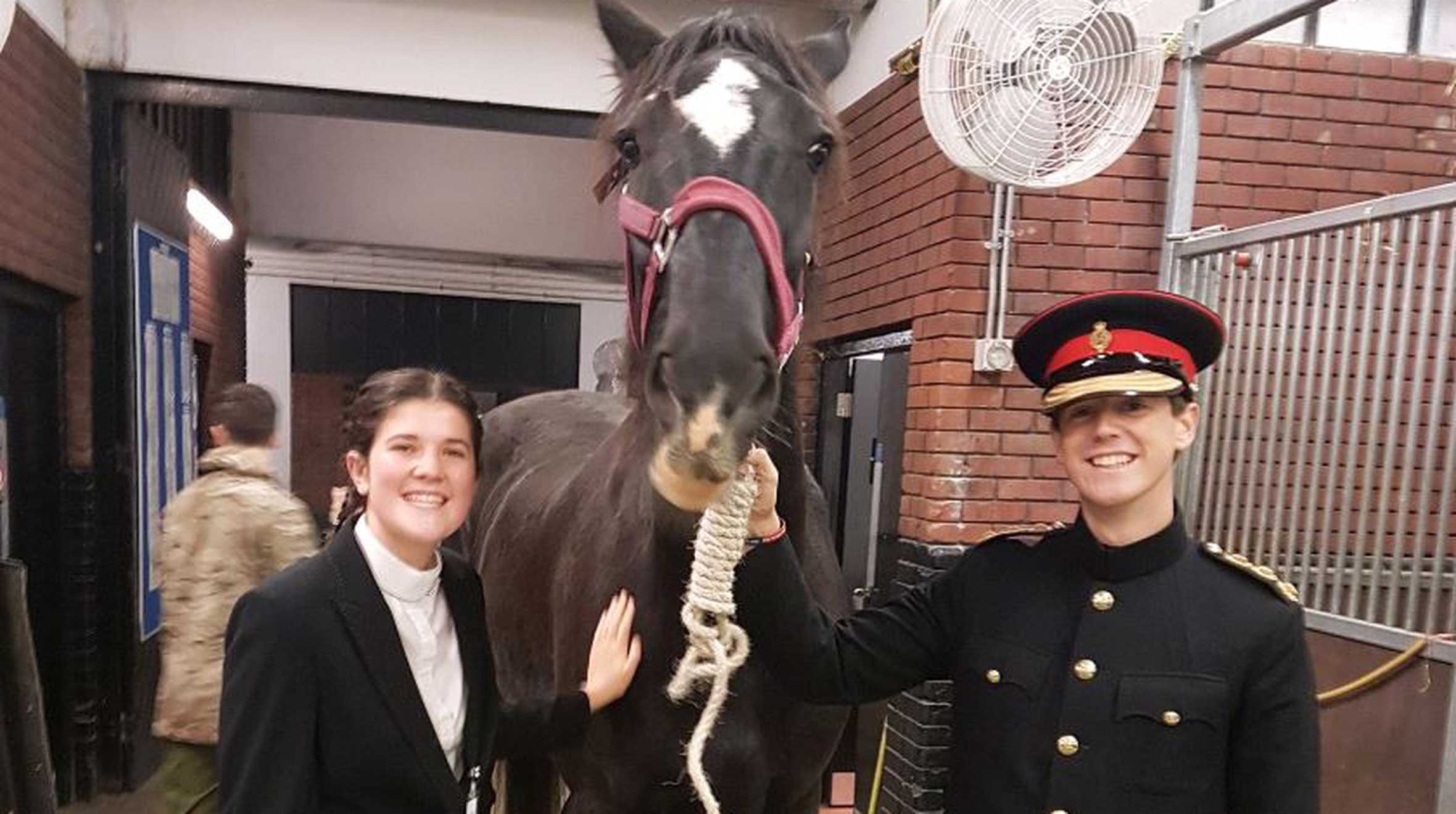 Emilia with horse and guard