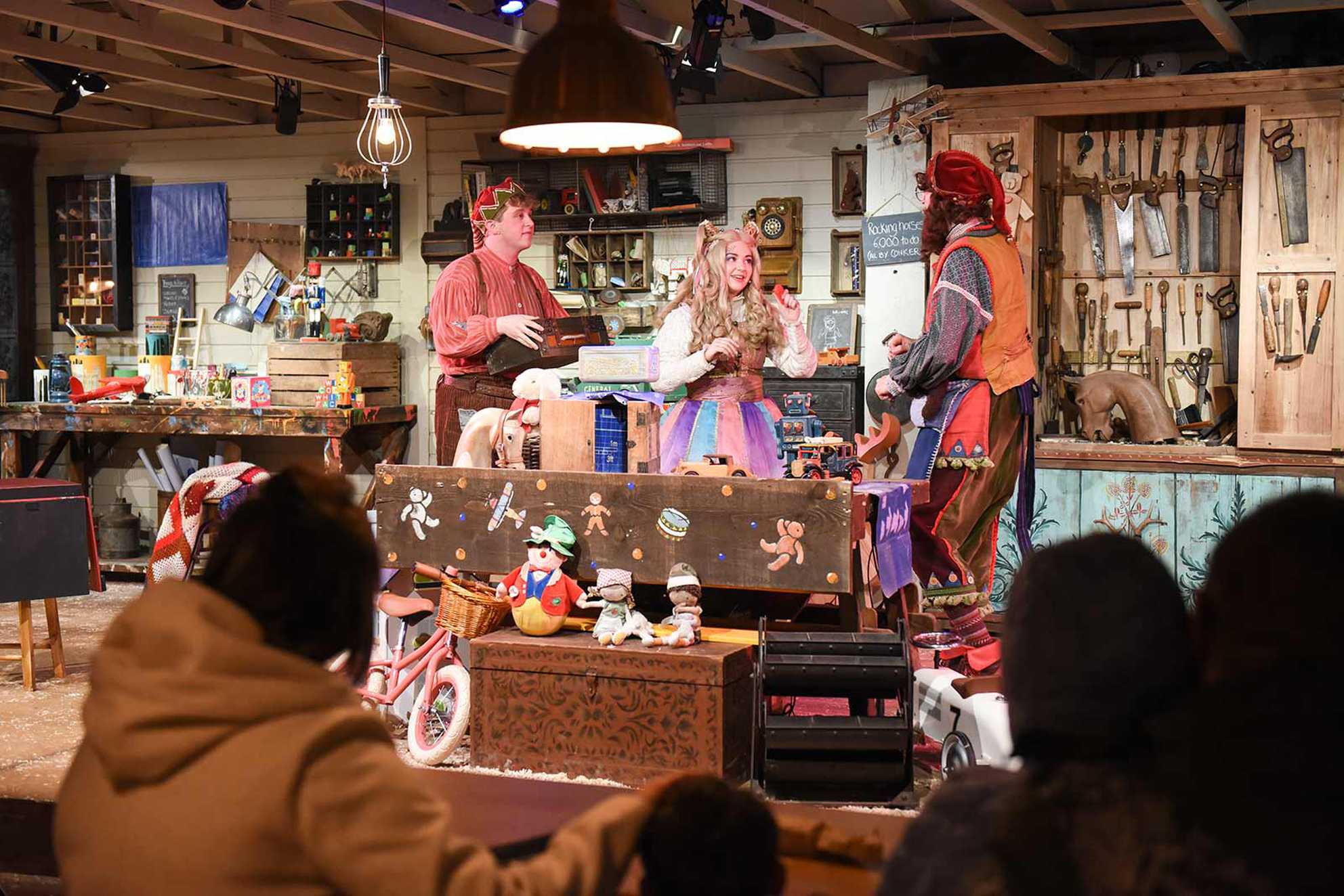 The family watching Elves hard at work in Santa's toy factory.