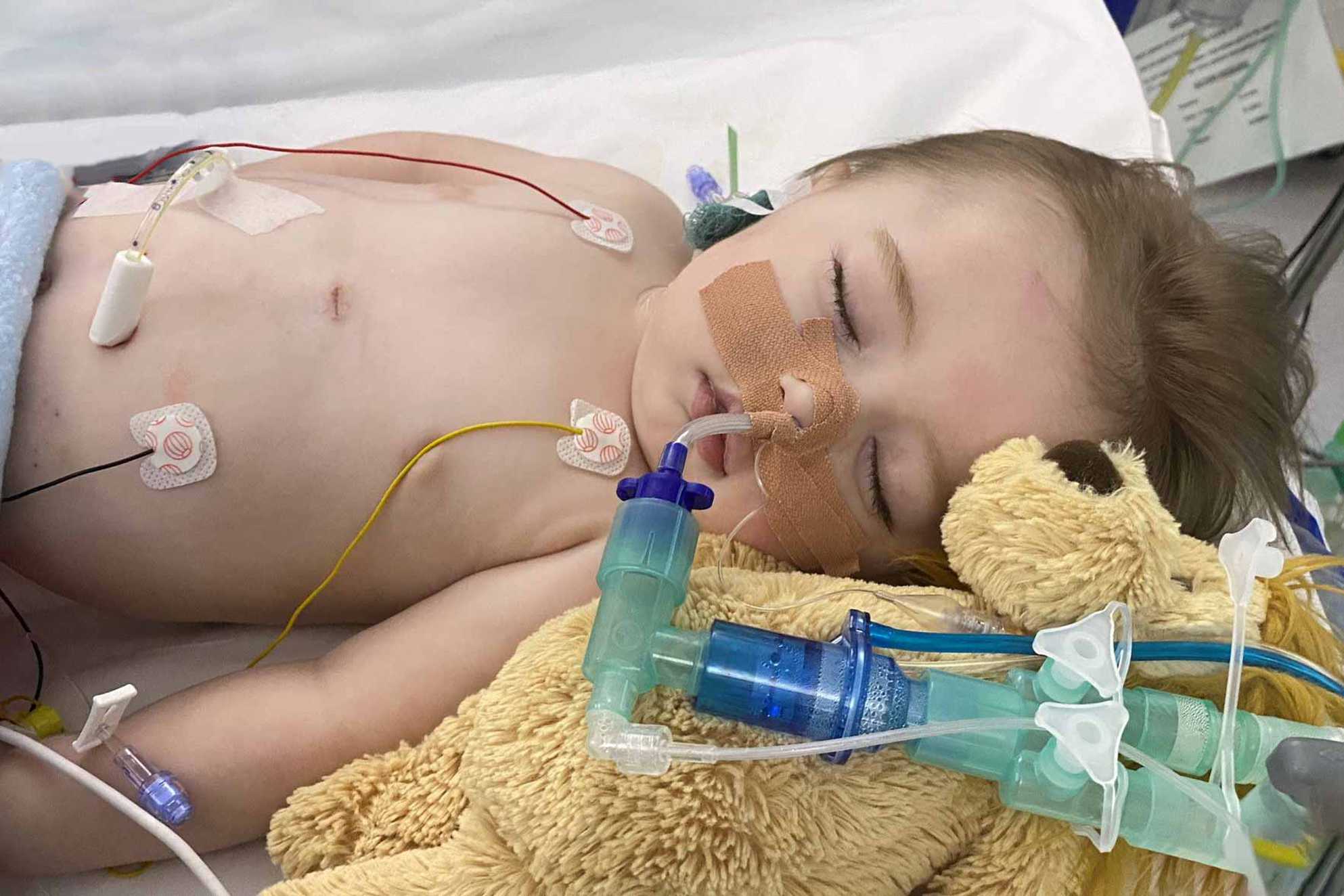 Wish child, Oliver in his hospital bed during treatment, with a cuddly toy next to him.