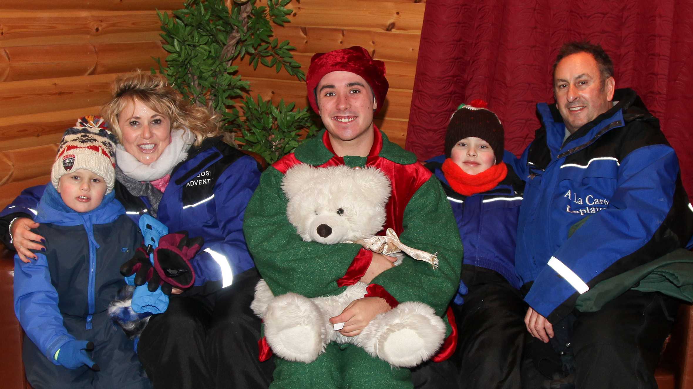 Finn and his family with an elf in Lapland