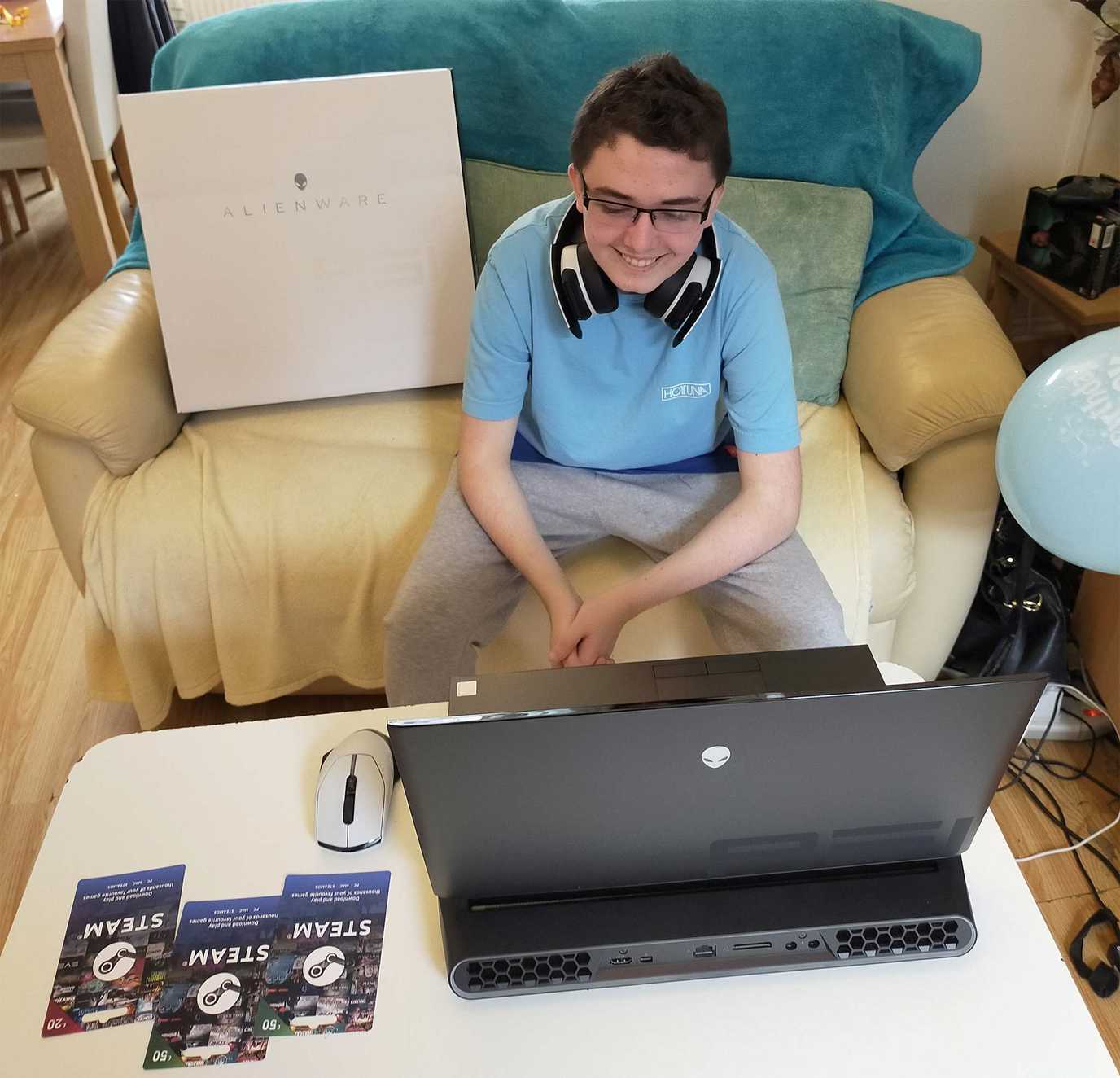 An excited Evan with his new Alienware gaming laptop.