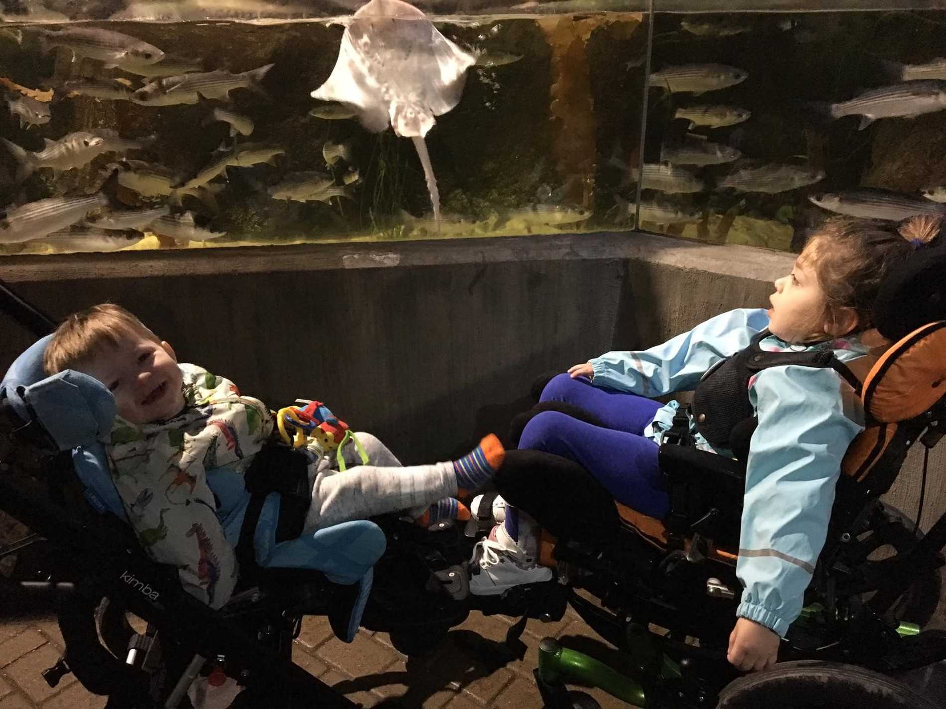 Aubree and her brother visiting an aquarium.