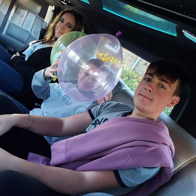 Alfie and his siblings in the limo on their way to the shopping centre for his wish.