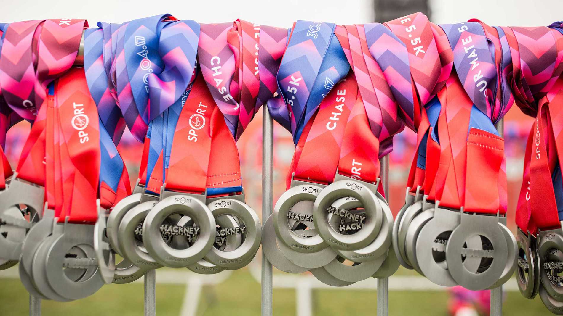 A bunch of Hackney Half Marathon finishers medals.