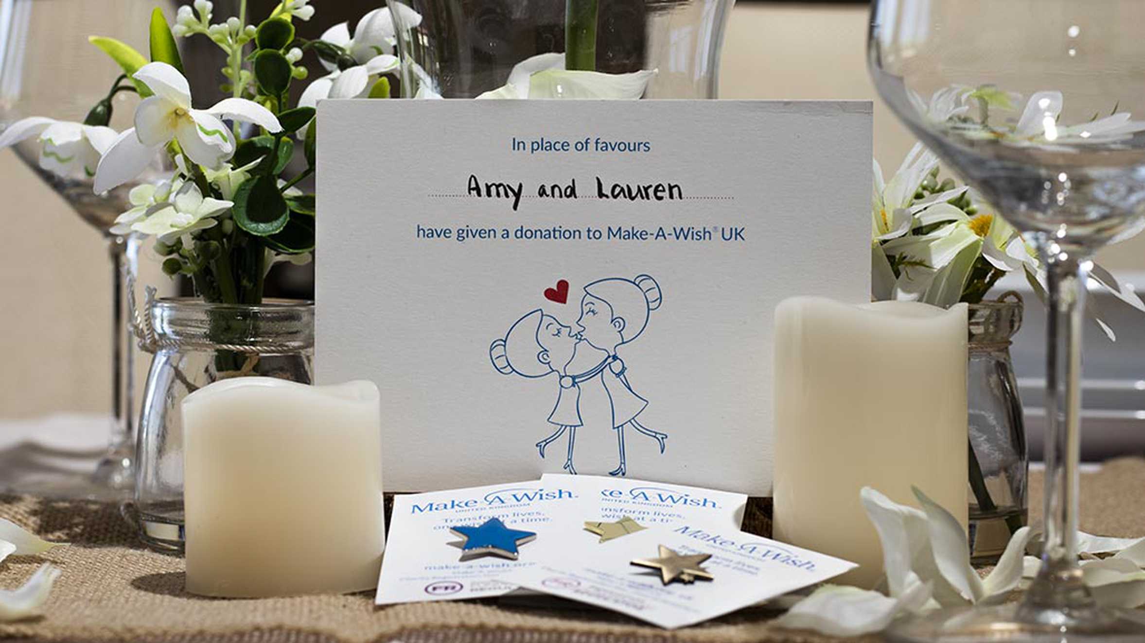 A collection of wedding favours and gift cards, laid out on a table