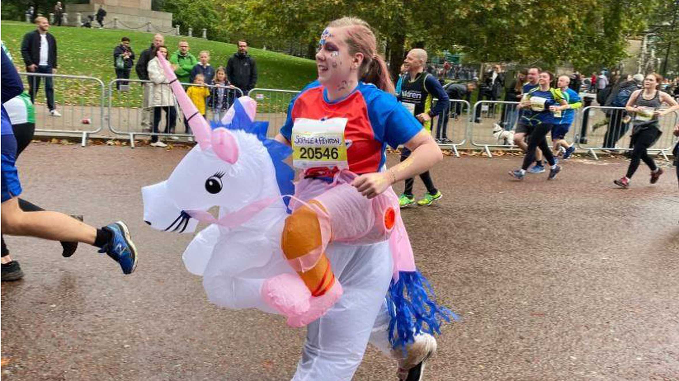 A #WishHero running in a unicorn fancy dress costume during the Royal Parks half marathon.
