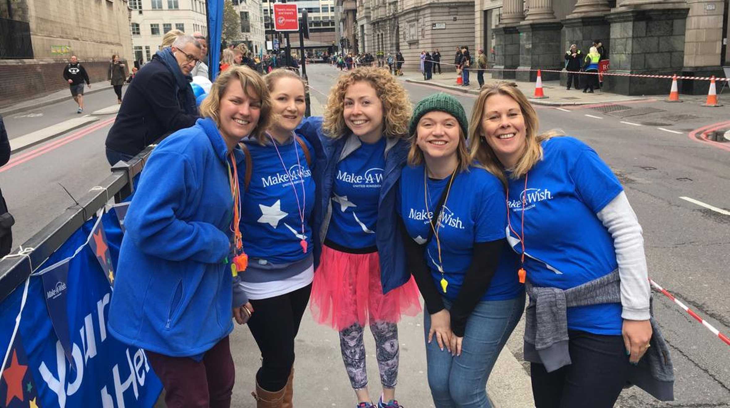 A group of cheerers in their blue Make-A-Wish t-shirts at the 2019 London Marathon.