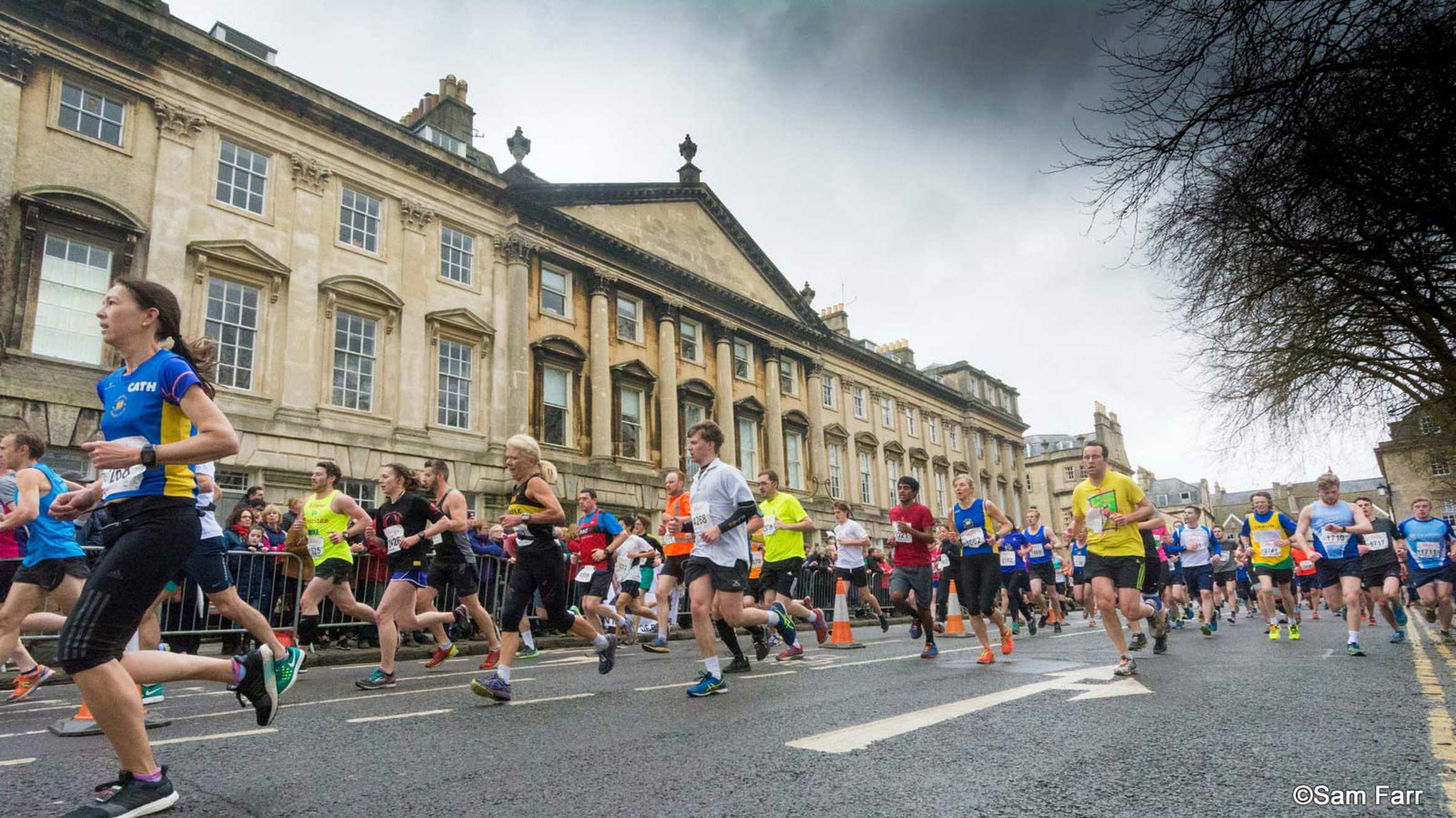 Runners passing by some of Bath's historic architecture (image © Sam Farr).